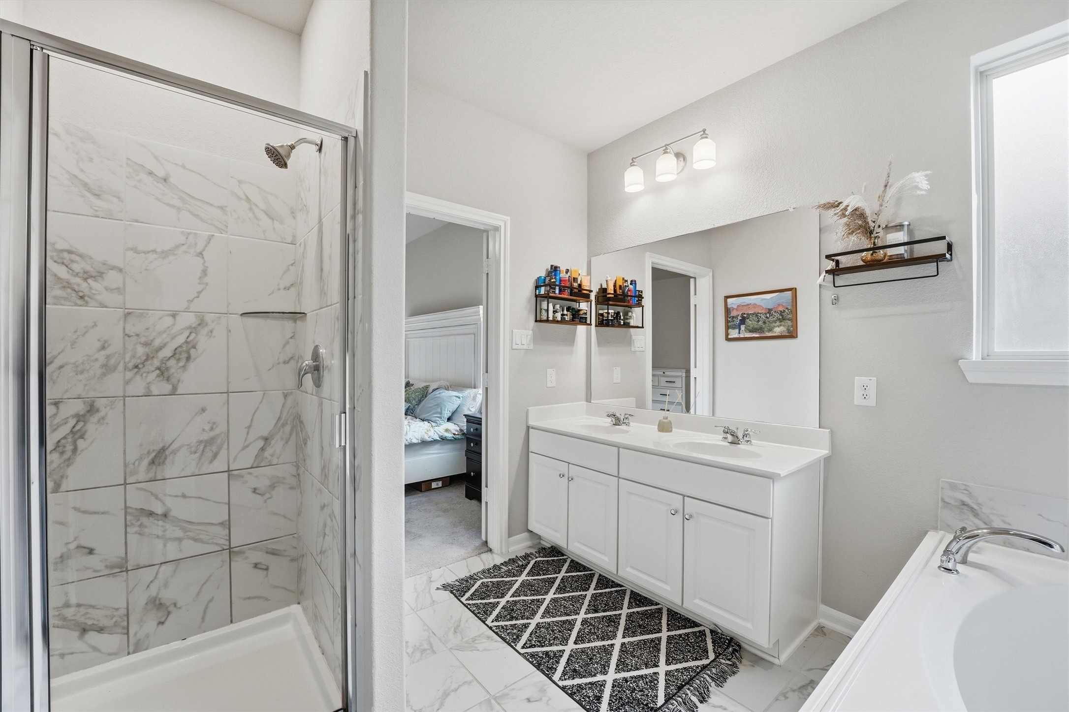 Primary bath also includes a separate shower.