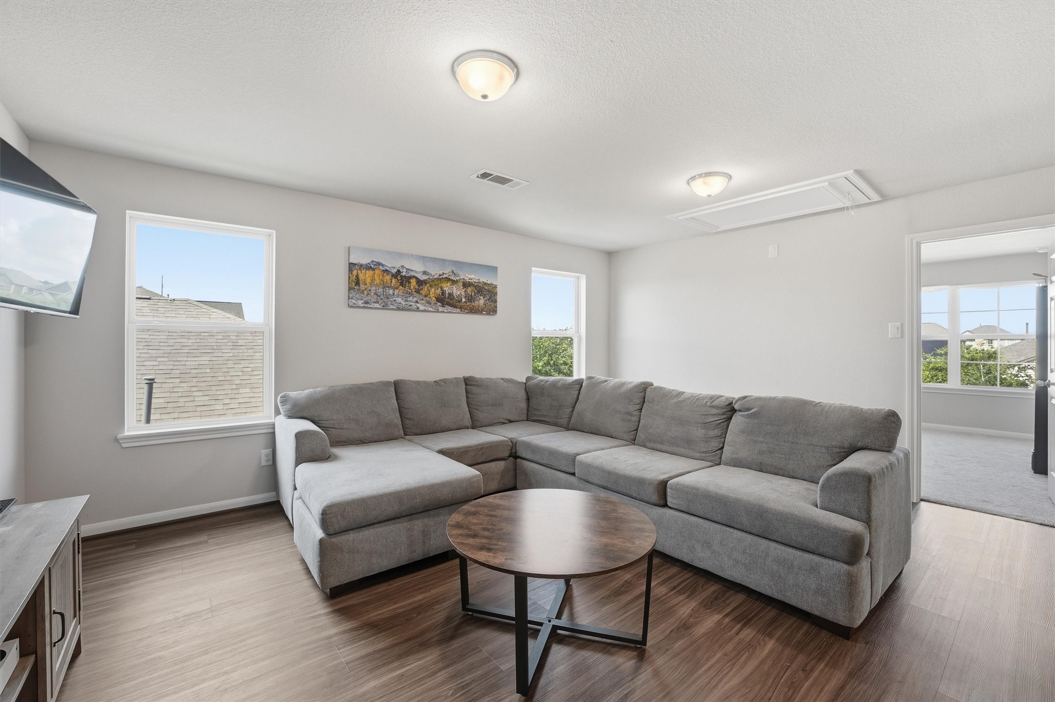 Bright and spacious game room with a natural light creating a cozy and inviting atmosphere.