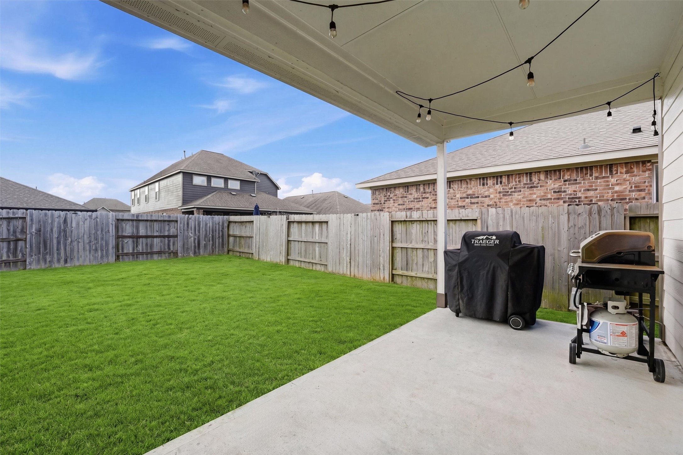 Covered patio with the potential to provide a private outdoor space ideal for entertaining or relaxing.