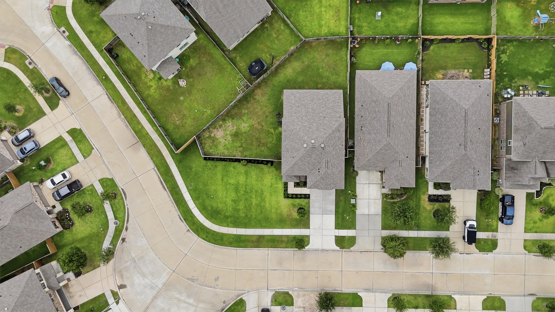 Another aerial view of home and yard.