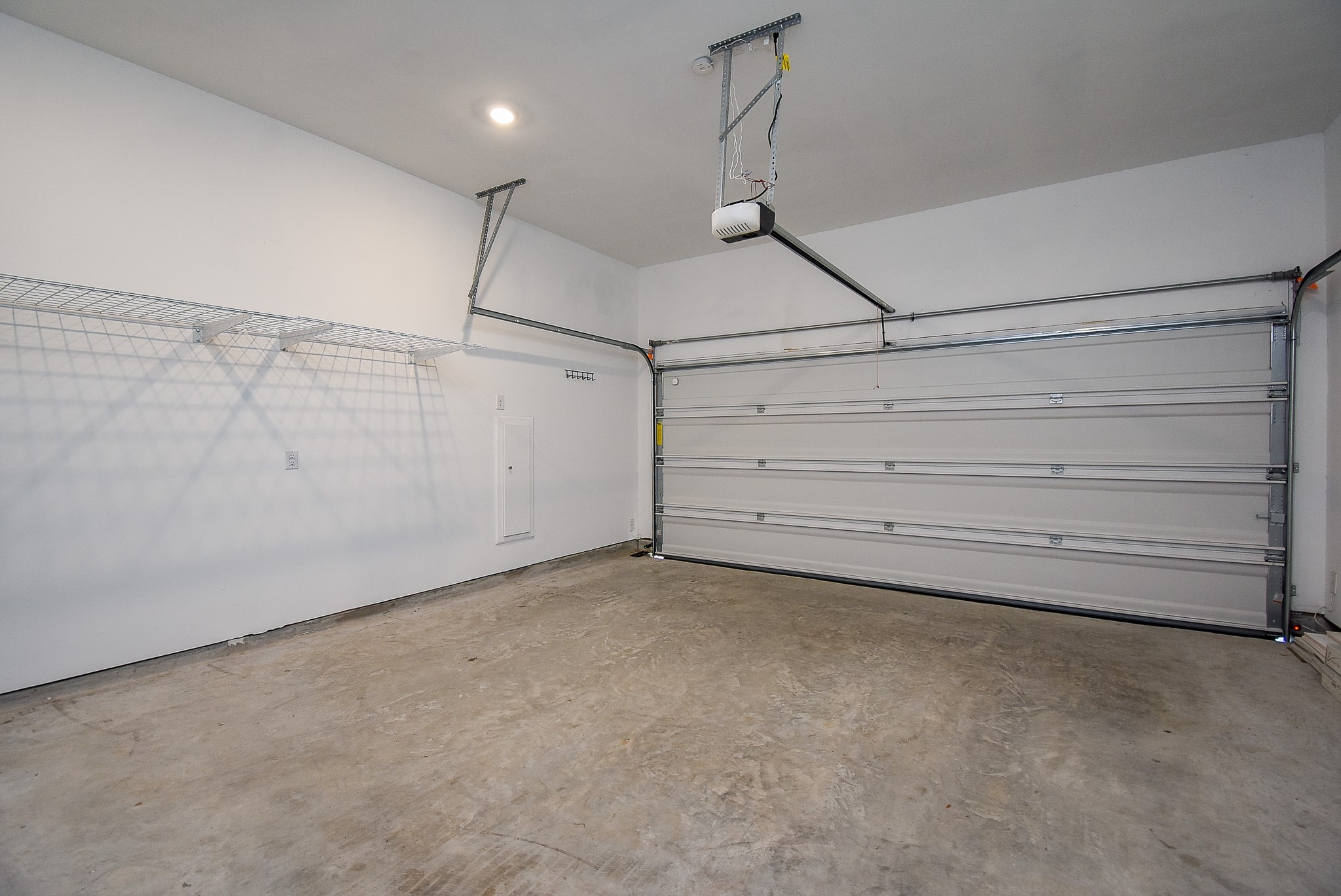 The large two car garage with an automatic door has plenty of space for your vehicles and some additional storage.