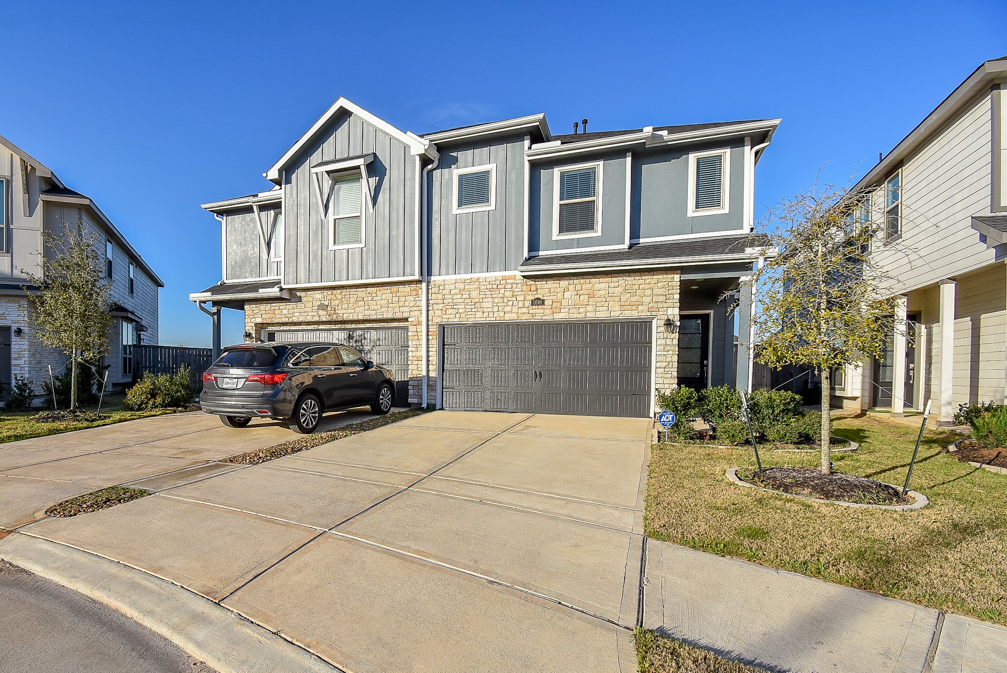 With a two car garage  and a double wide driveway,  there is ample parking available.