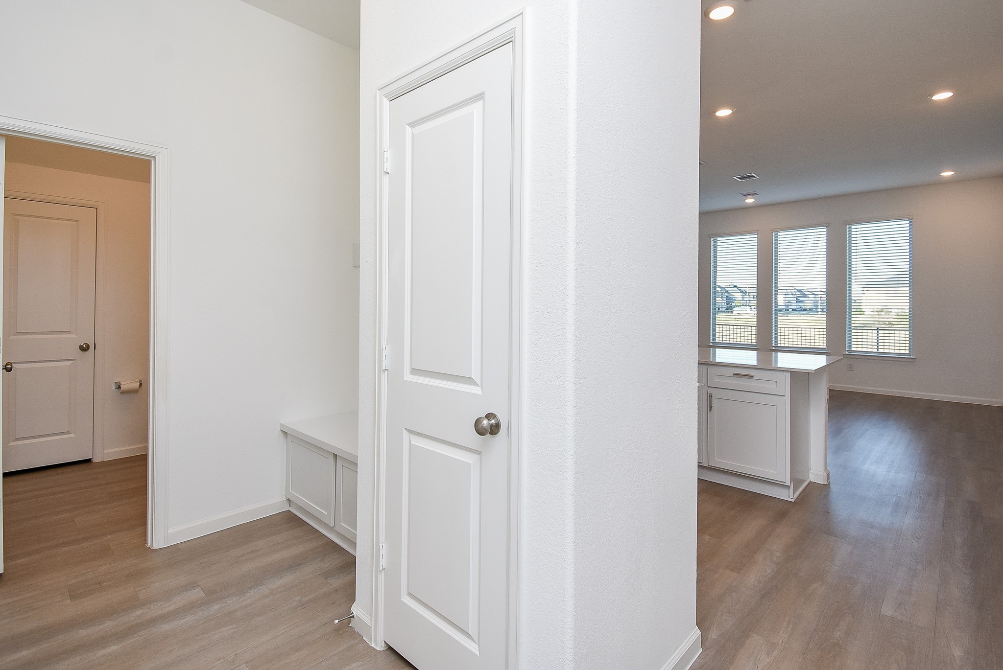 Step inside from the garage to the built in mud area and coat closet.