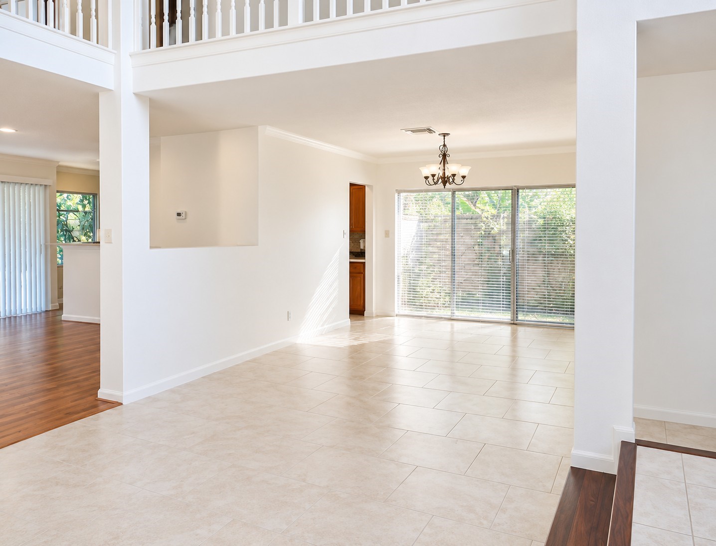 Open-concept living and dining areas with high ceilings and abundant natural light.