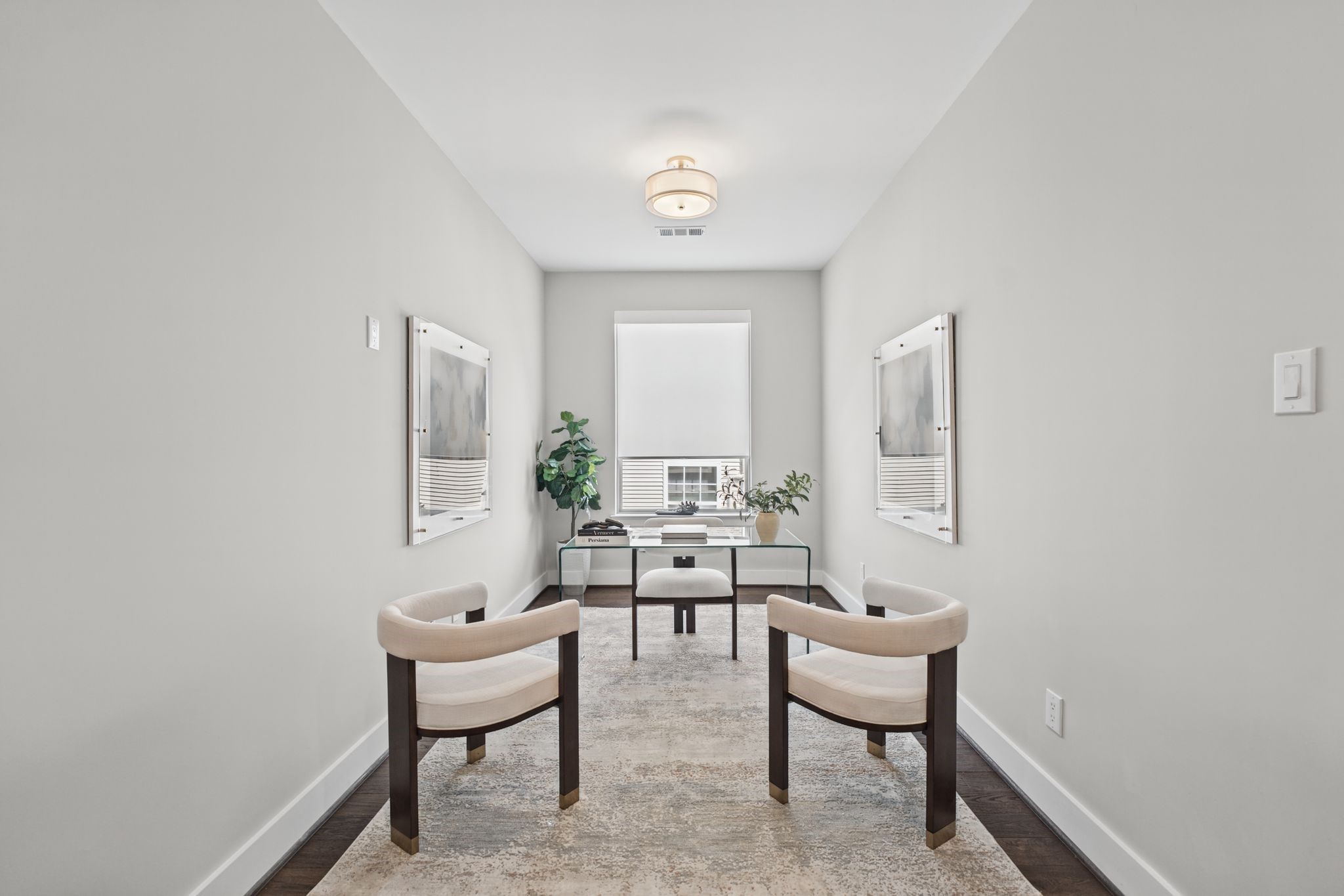 A versatile secondary space offers an inviting setting for a quiet sitting area, reading nook, or thoughtfully appointed home office.