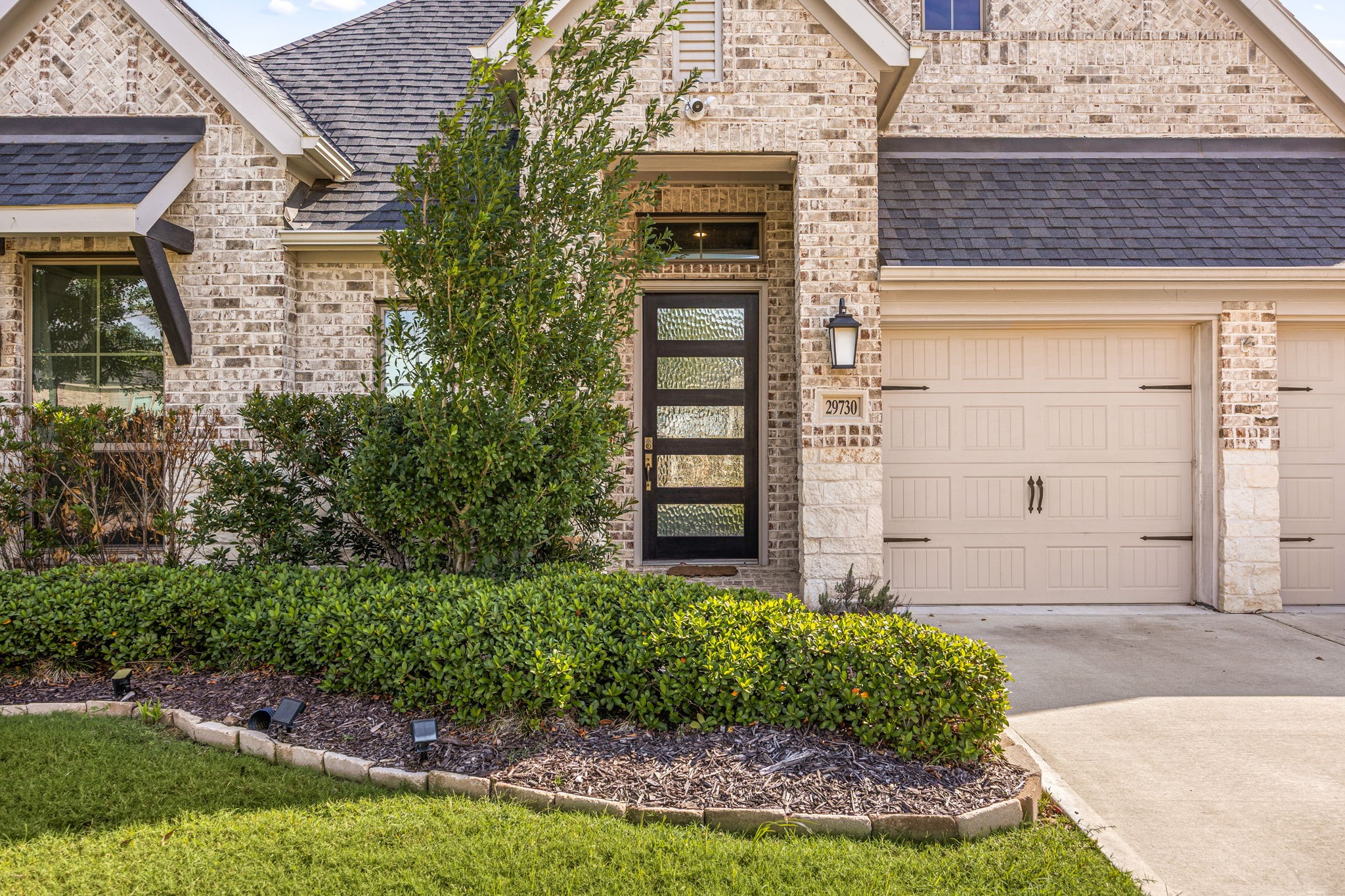 From the street, you are welcomed by a beautiful brick and stone exterior, a double-wide concrete driveway, and a two-car attached garage. Step through the West-facing front door to find your own private escapea backyard garden oasis with no rear neighbors, perfect for quiet mornings or hosting friends. From the street, you are welcomed by a beautiful brick and stone exterior, a double-wide concrete driveway, and a two-car attached garage. Step through the West-facing front door to find your own private escapea backyard garden oasis with no rear neighbors, perfect for quiet mornings or hosting friends.