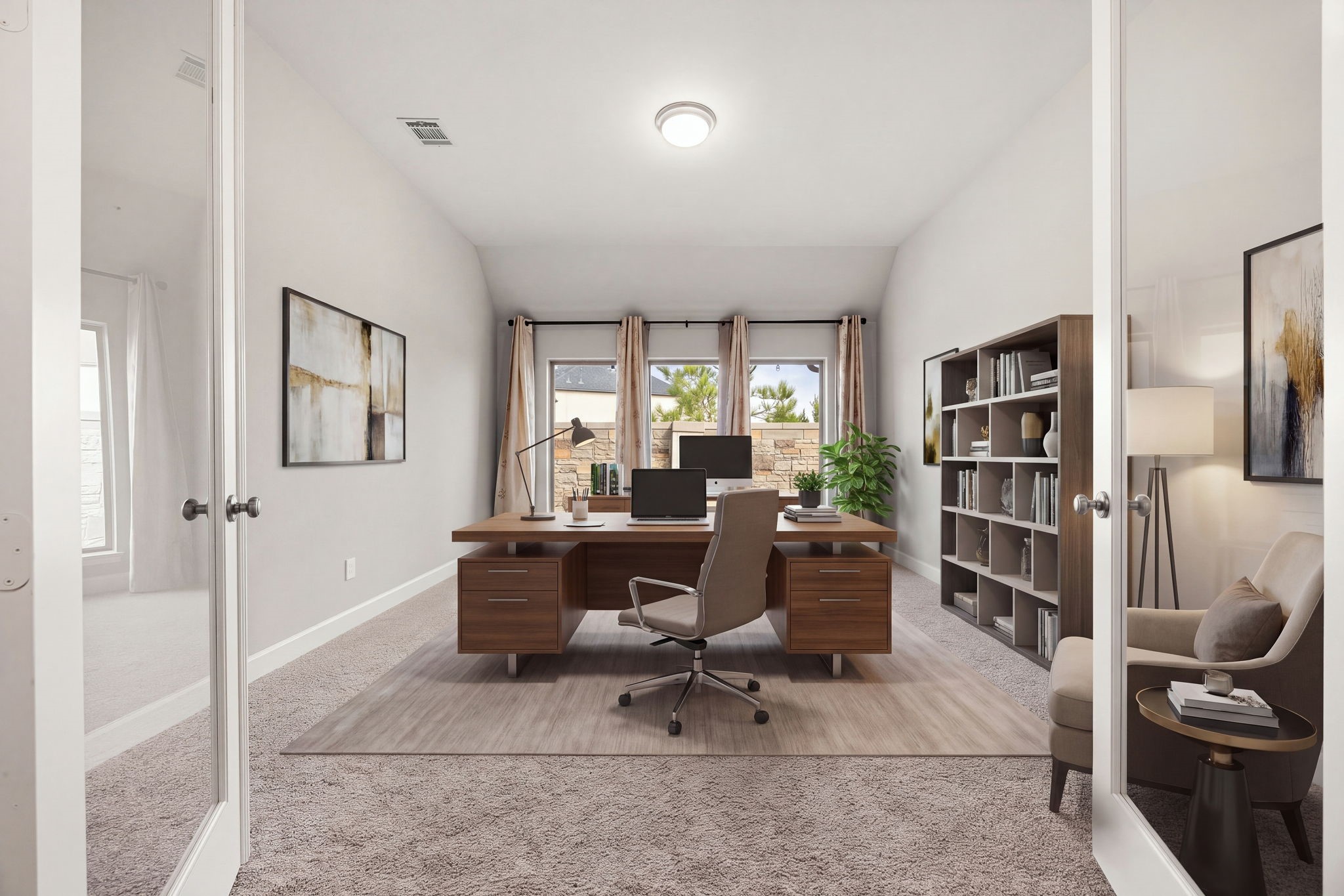 Tucked behind elegant double French doors, this versatile room serves as the ultimate dedicated home office or game room. The space boasts high ceilings, plush carpeting, and a trio of tall windows that creates a bright and quiet environment that is perfect for remote work or study. *Virtually Staged