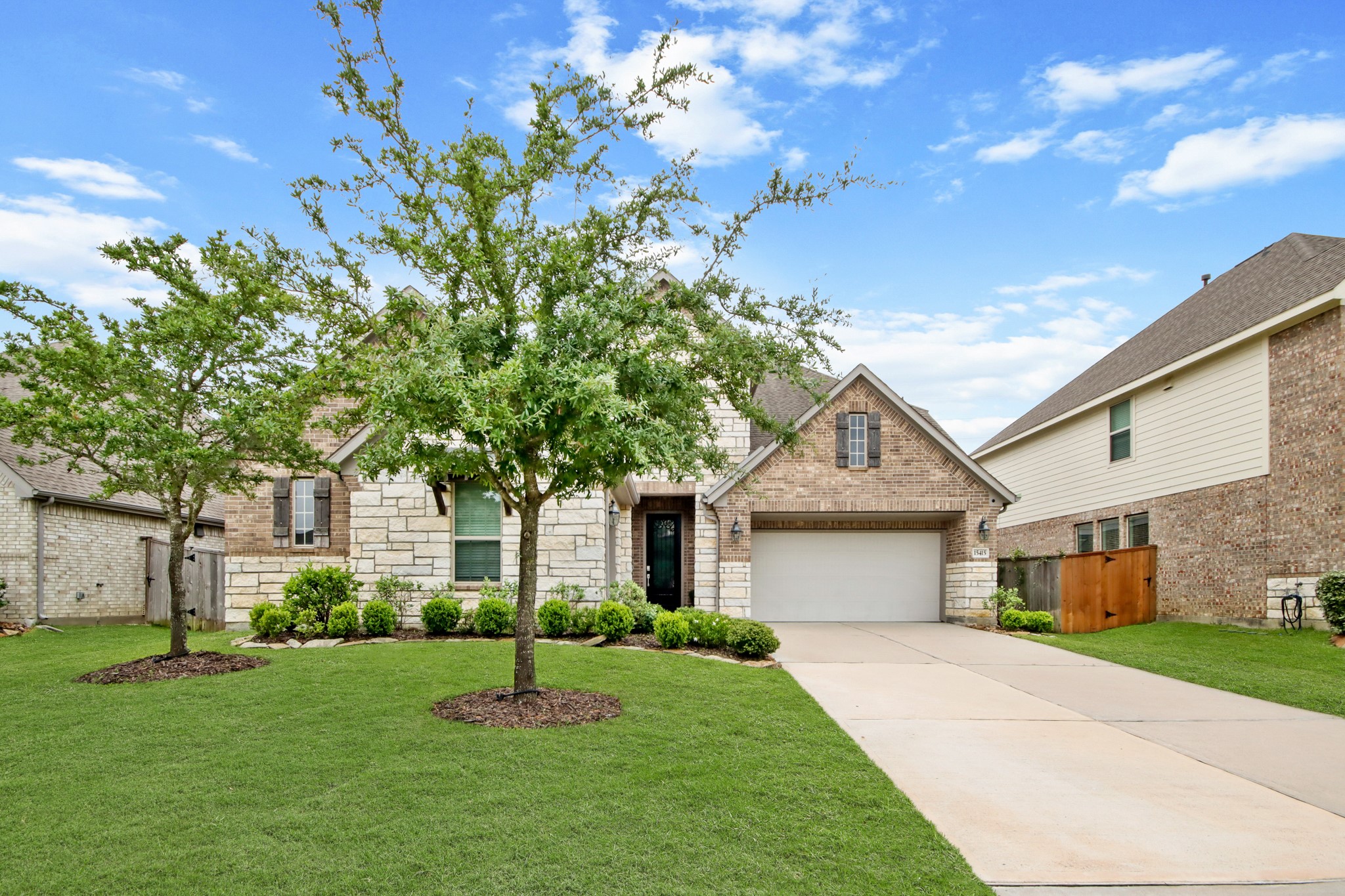 Lush landscape, full trees add to the curb appeal