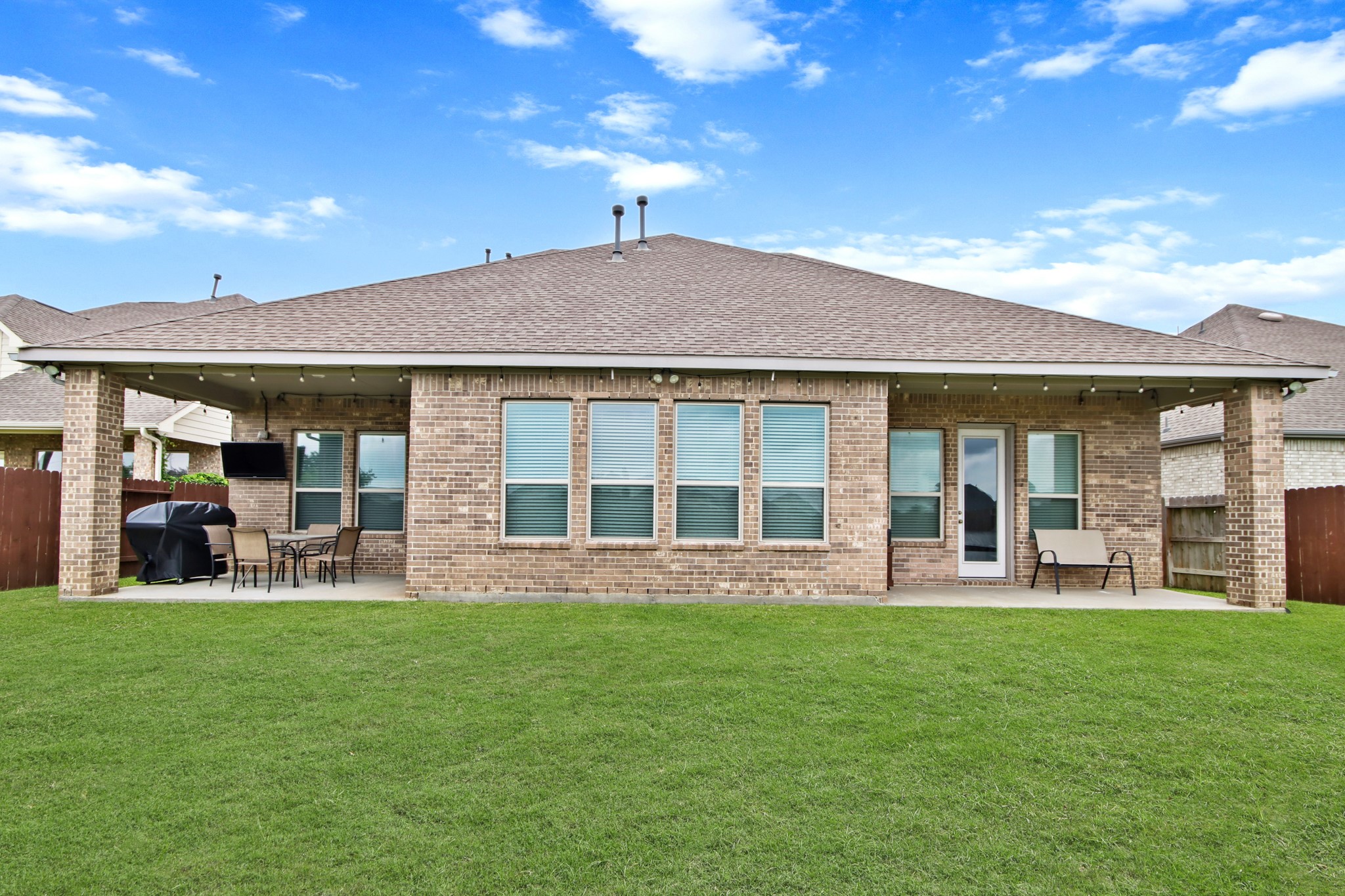 Appealing outdoor entertaining along with tons of green space for play.