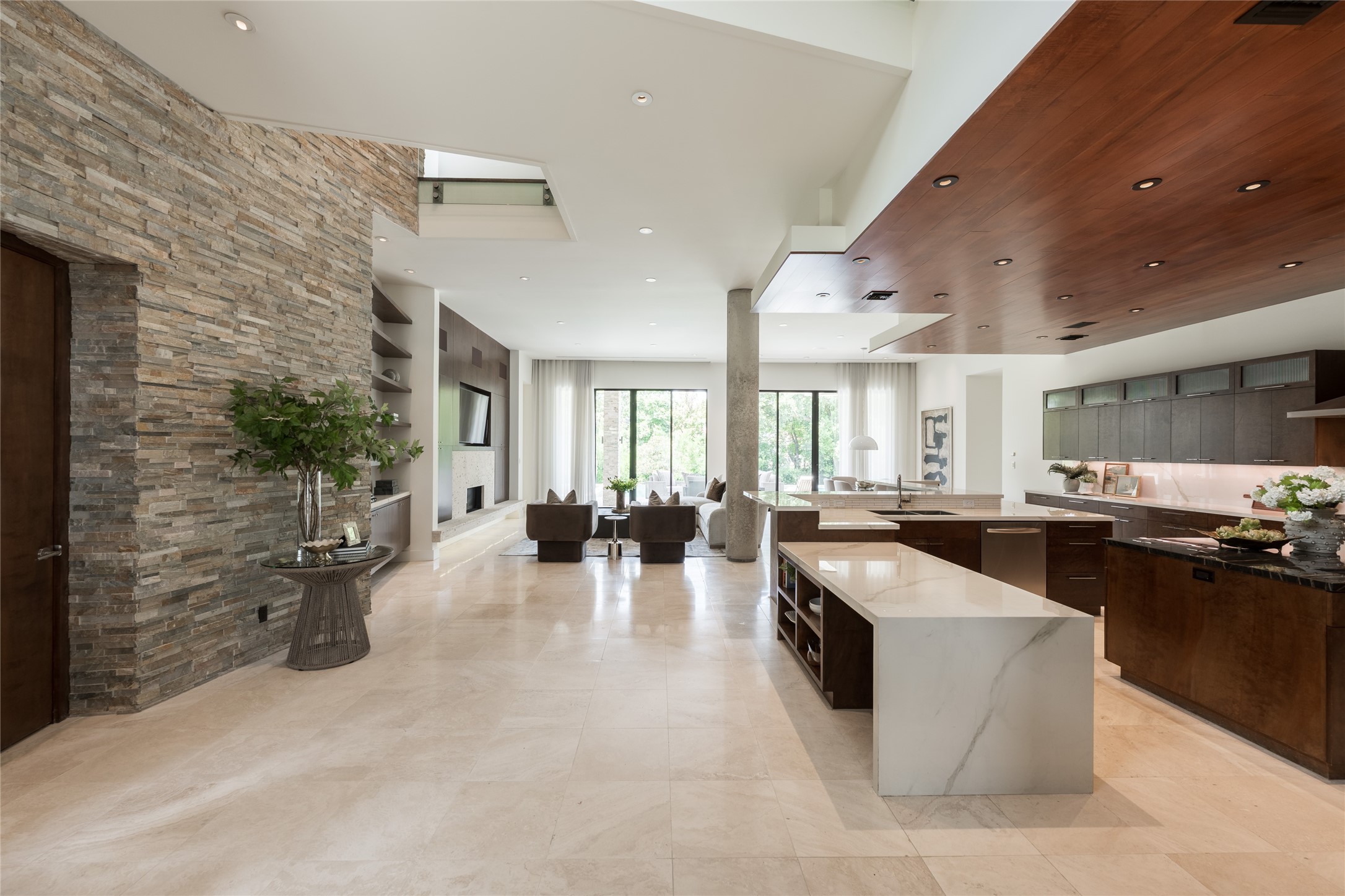 The kitchen sits at the center of the homes open living environment, with an expansive porcelain island that transition to a table top seating area creating a natural transition between cooking, gathering and the family room.