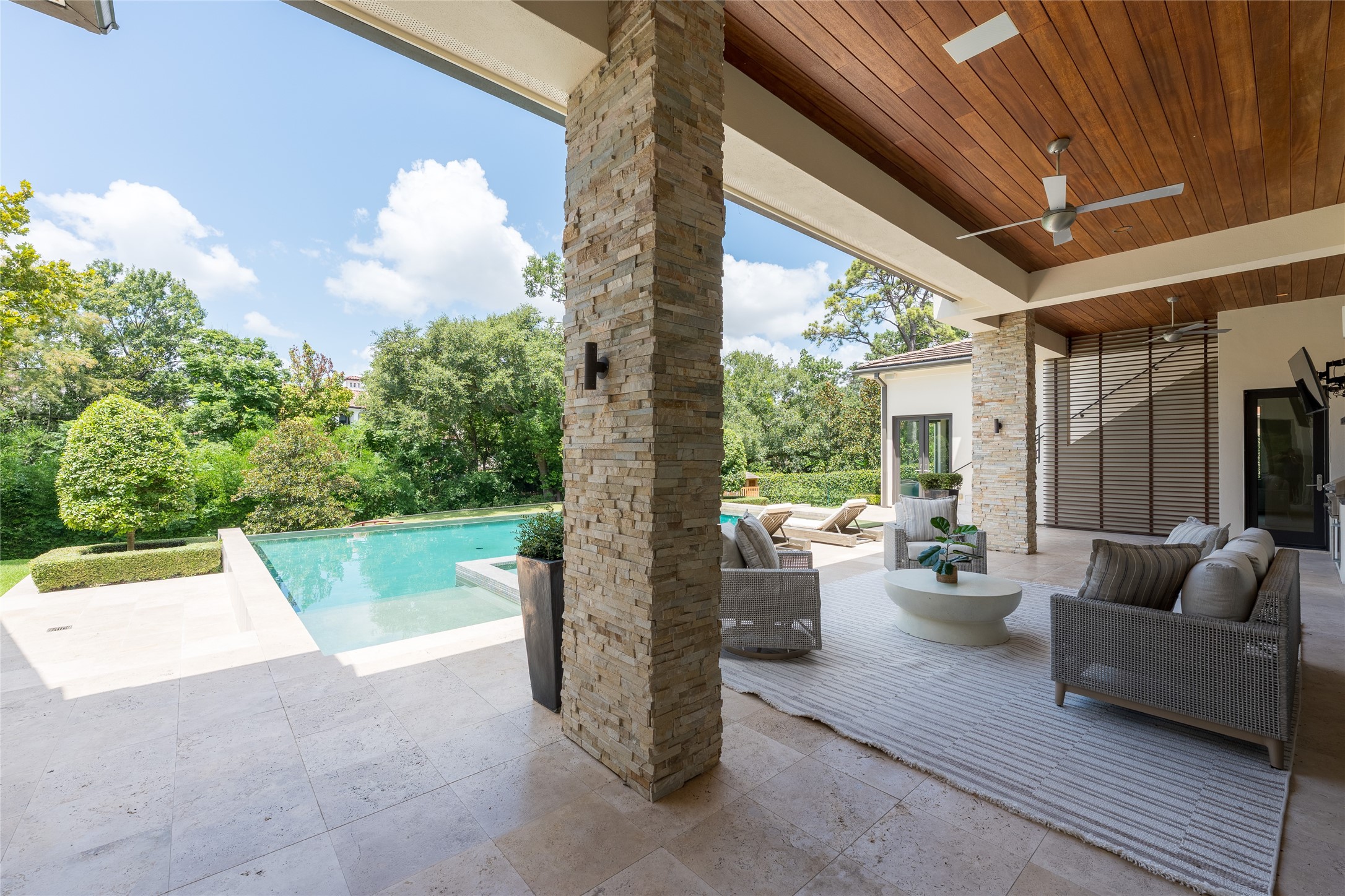Lush, mature landscaping surrounds the residence, creating a level of privacy and greenery that feels more suburban than urban. Yet the home remains positioned in the heart of Houston, just moments from Memorial Park and the citys core.