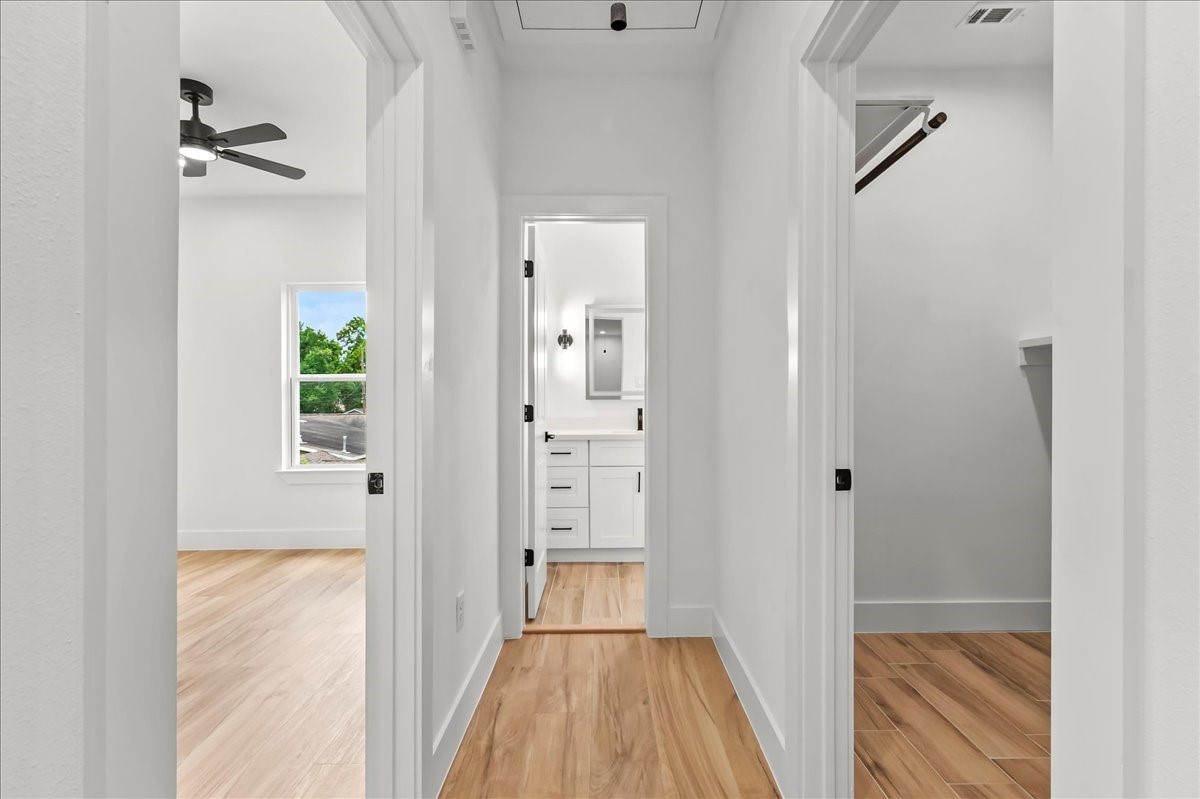Unit B - The thoughtfully designed second-level split floor plan offers added privacy and functionality, with the primary suite separated from the secondary bedrooms.