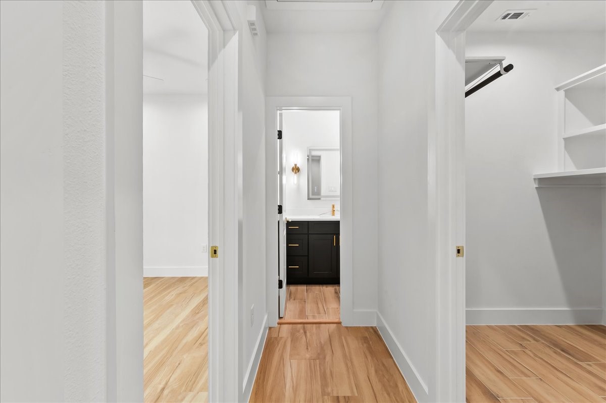 Unit A - The thoughtfully designed second-level split floor plan offers added privacy and functionality, with the primary suite separated from the secondary bedrooms.