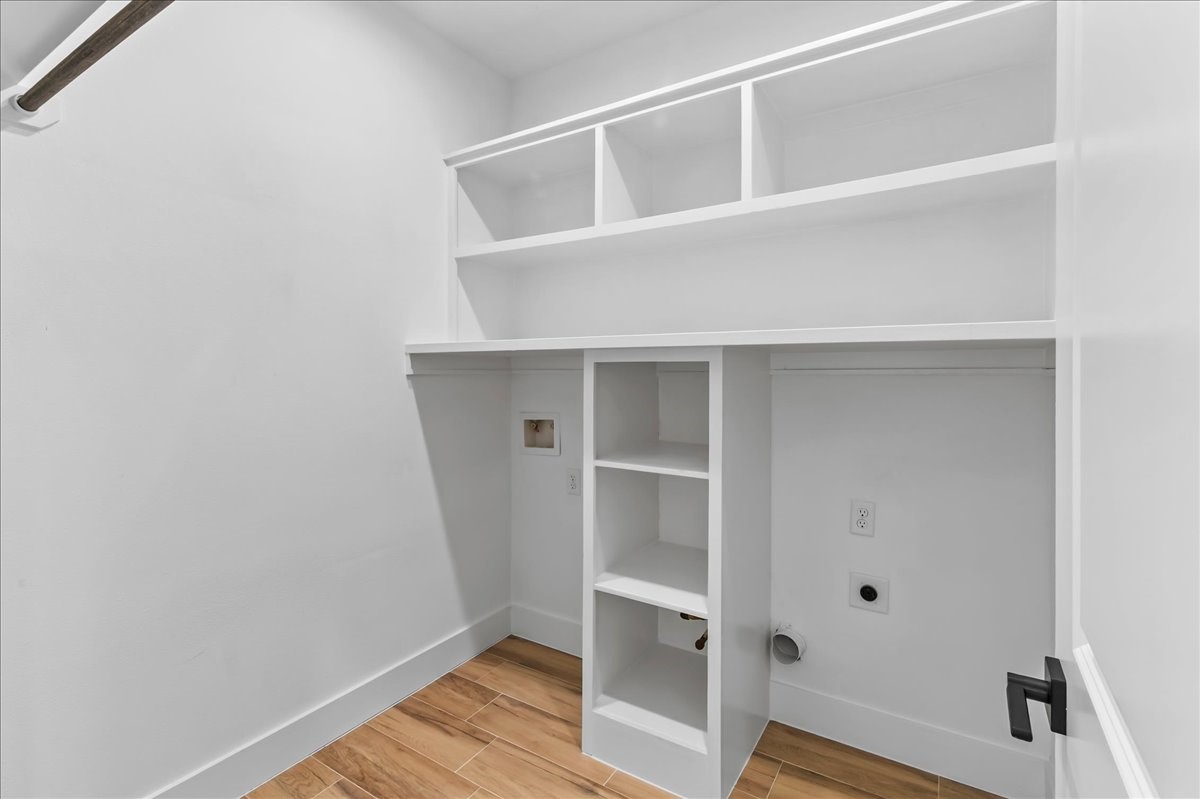 Convenient laundry room featuring both electrical and gas connections for added flexibility and functionality. Design may vary. Pictures are from a previous build.