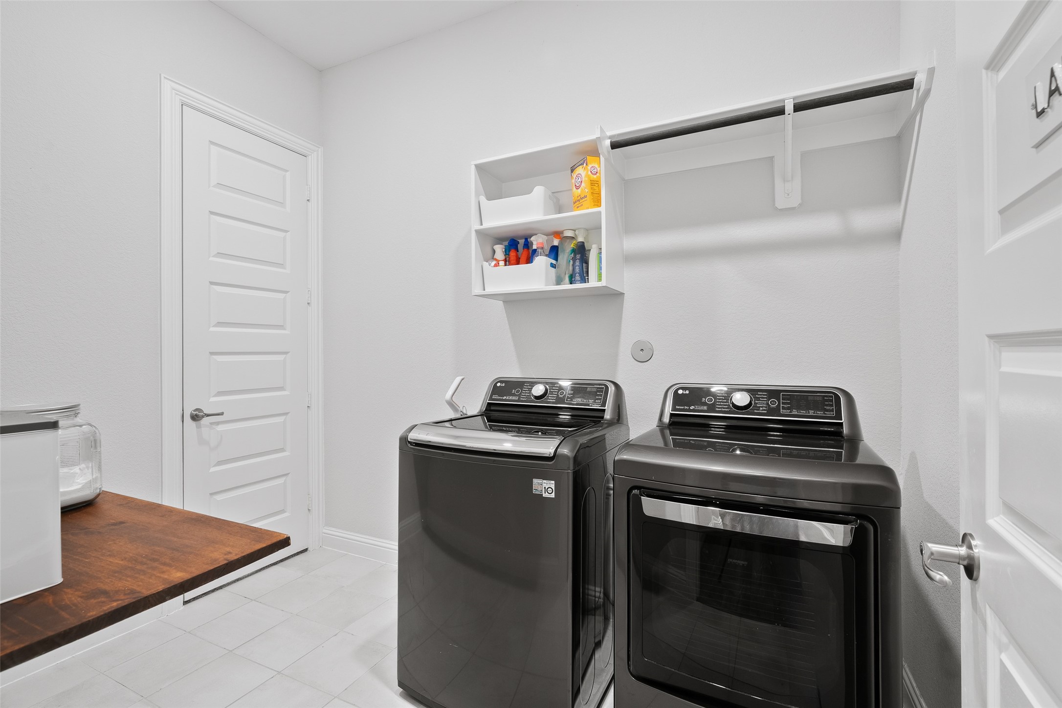 Across from the mud area is a large utility/laundry room that connects to the owner's suite walk-in closet and the mud room. Electric outlet for dryer.