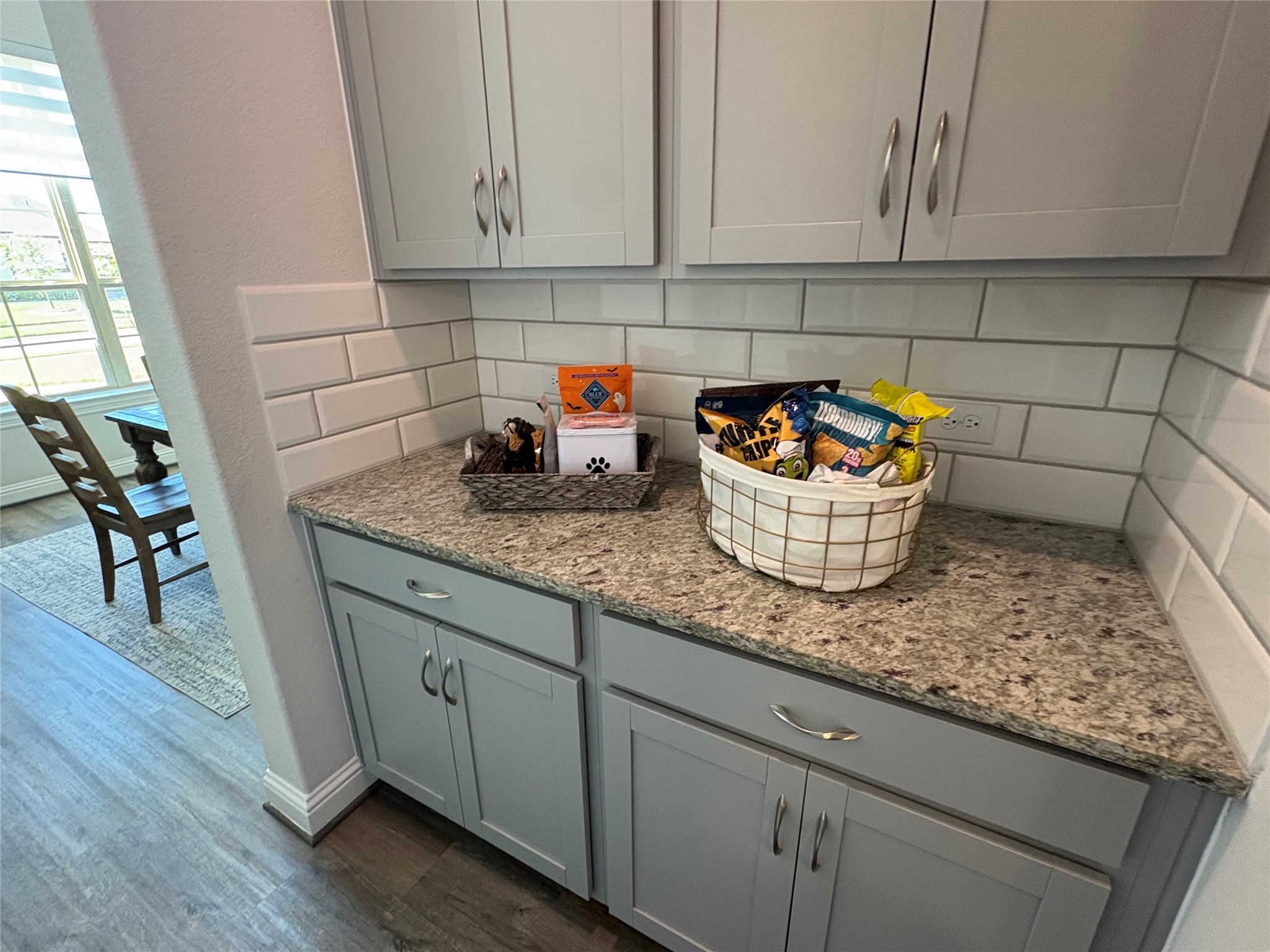 The butler's pantry is between the formal dining area and the kitchen.  It's ideal as a beverage station, coffee bar, or additional serving and storage.