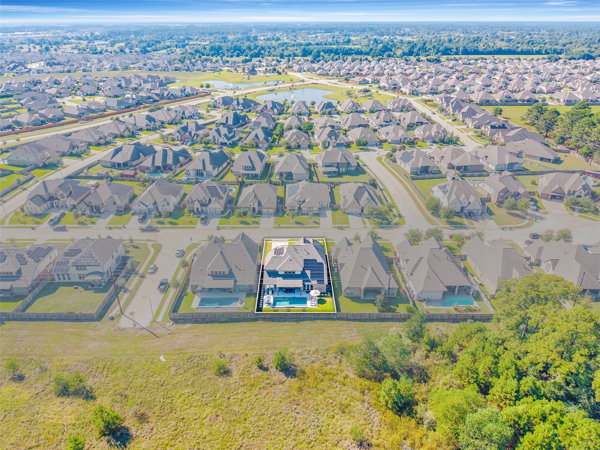 Located in a low-traffic part of the subdivision, you can access FM 2920 or Grand Parkway 99 within a few minutes. The community amenities are shown near the top of this photo.
