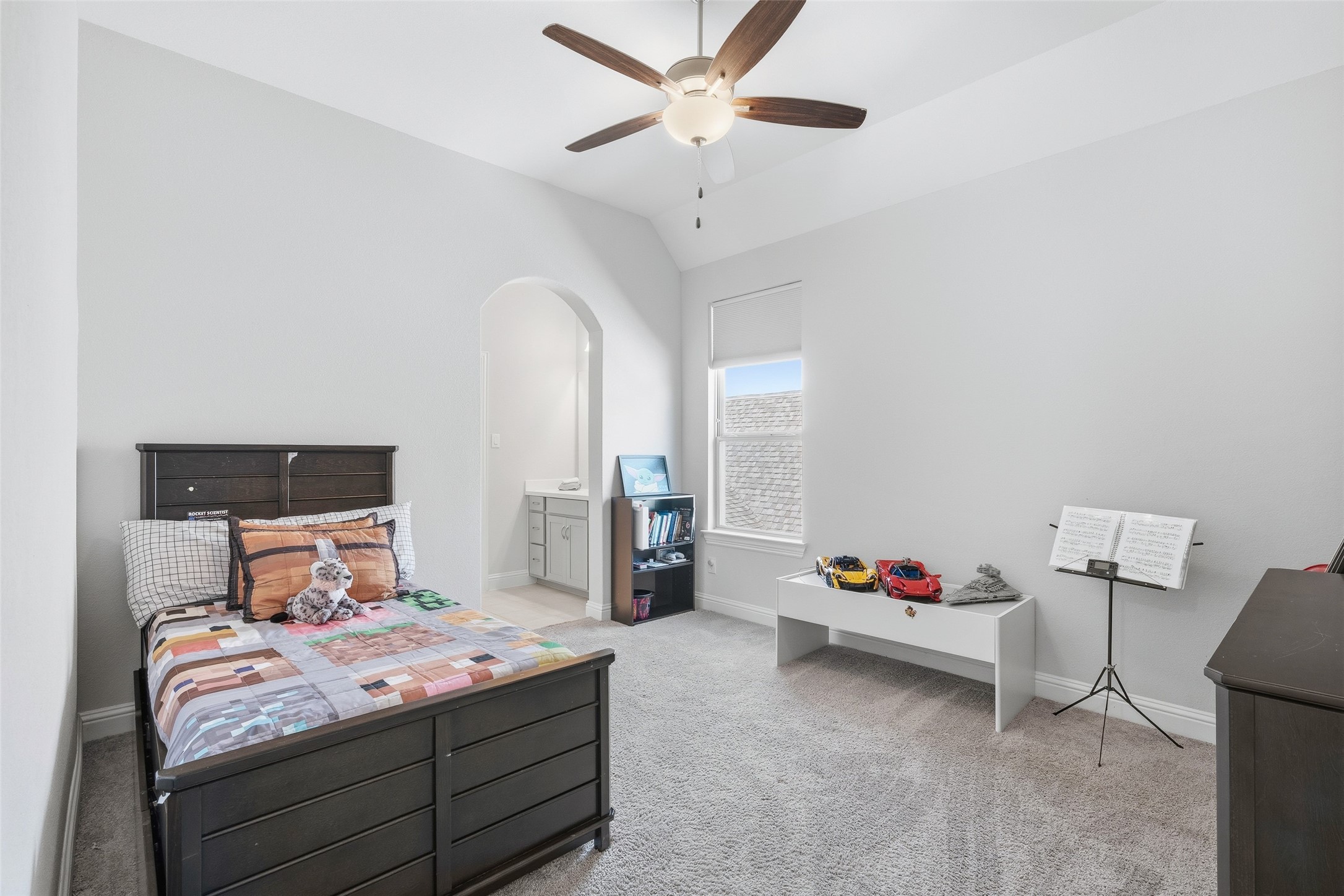 Bedroom 3 on second floor with separate sink and walk-in closet.  Jack and Jill style combo tub shower.