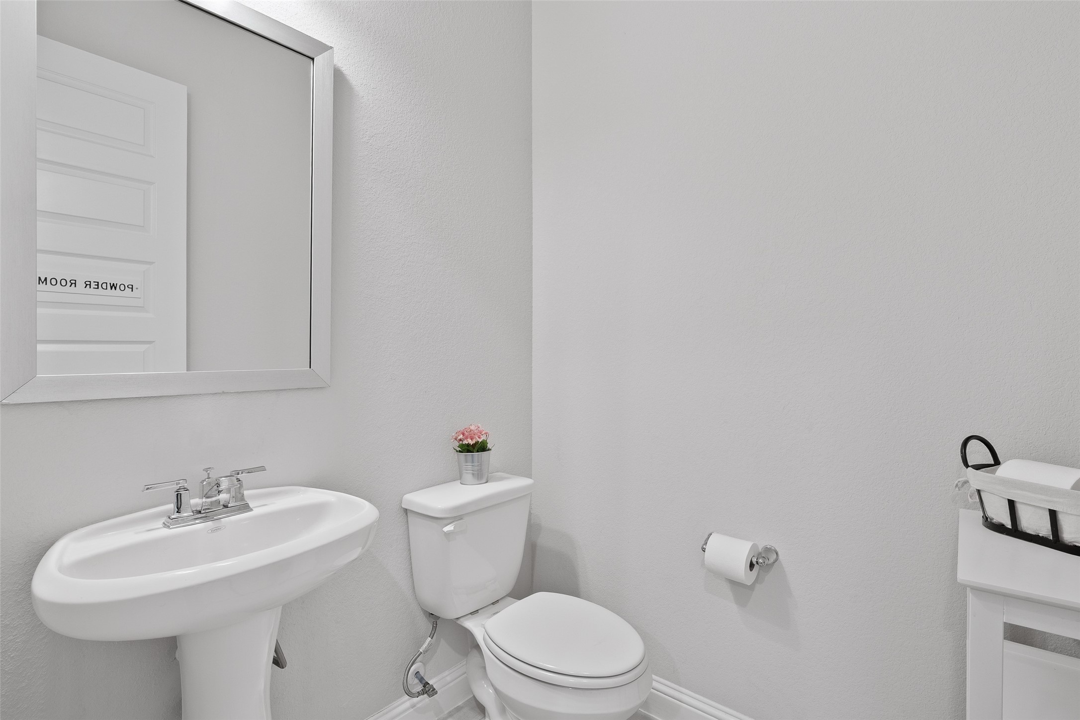 A half bath on the first floor is just outside the media room.