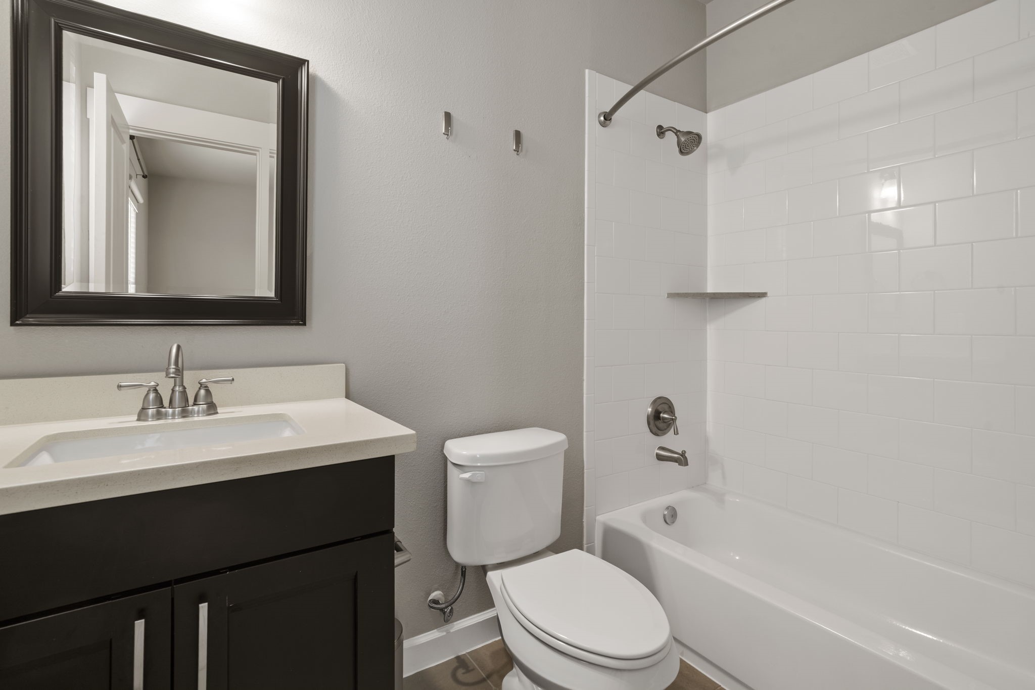 The en suite bathroom includes a shower/tub combination, complementing the home's impressive offering of three full bathrooms and one half bathroom.