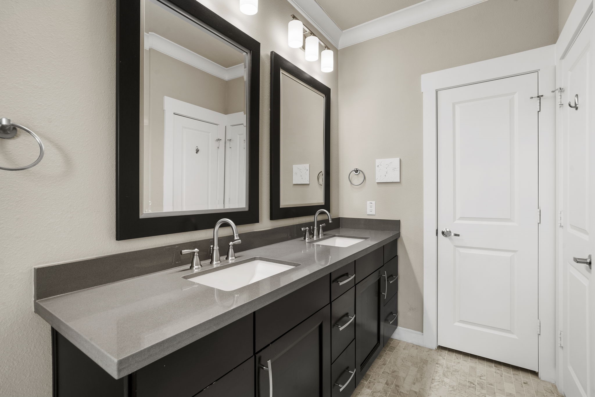 Sleek, modern dual vanity with a quartz countertop and plenty of storage underneath.