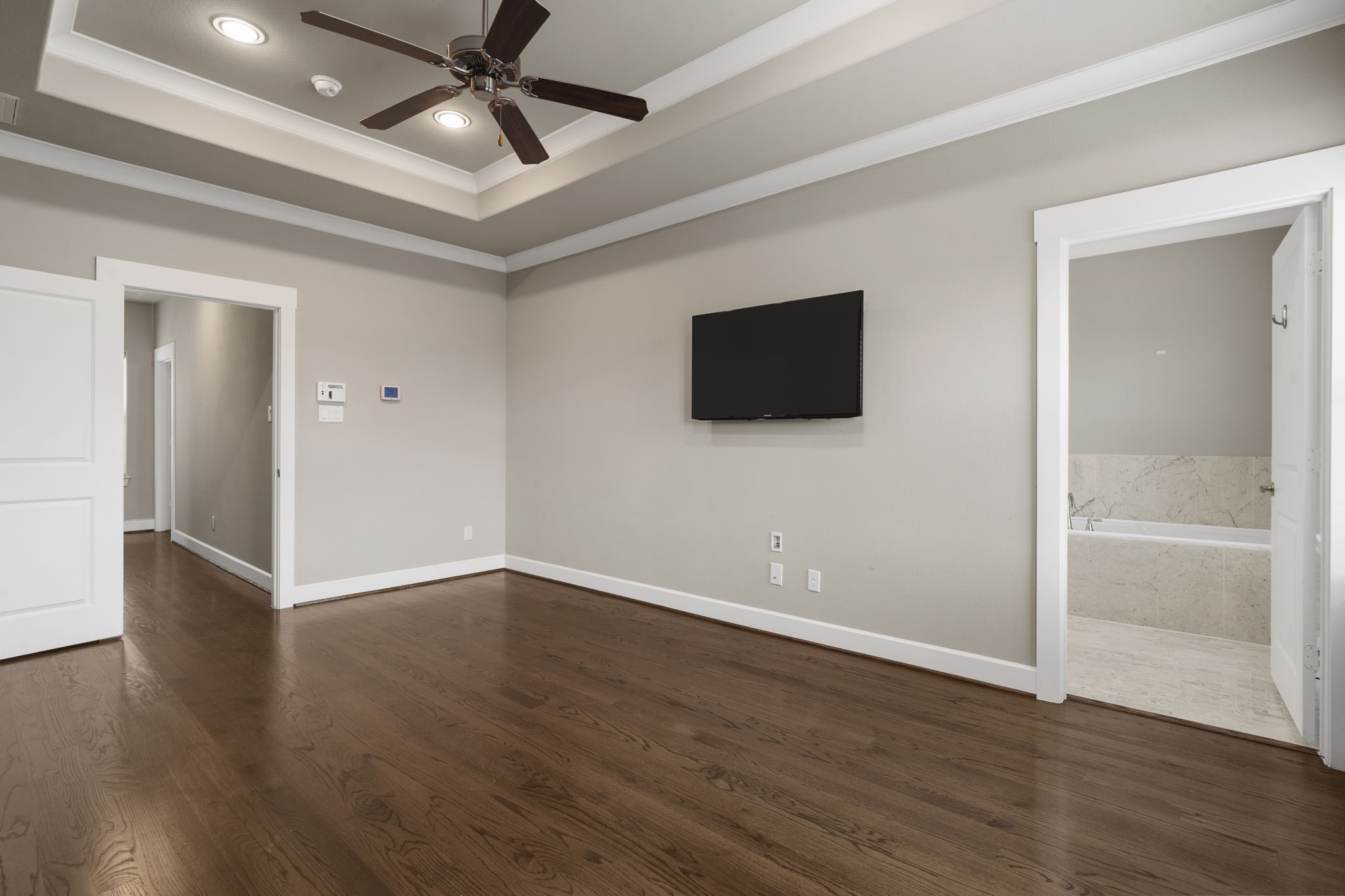 An elegant tray ceiling adds architectural interest.