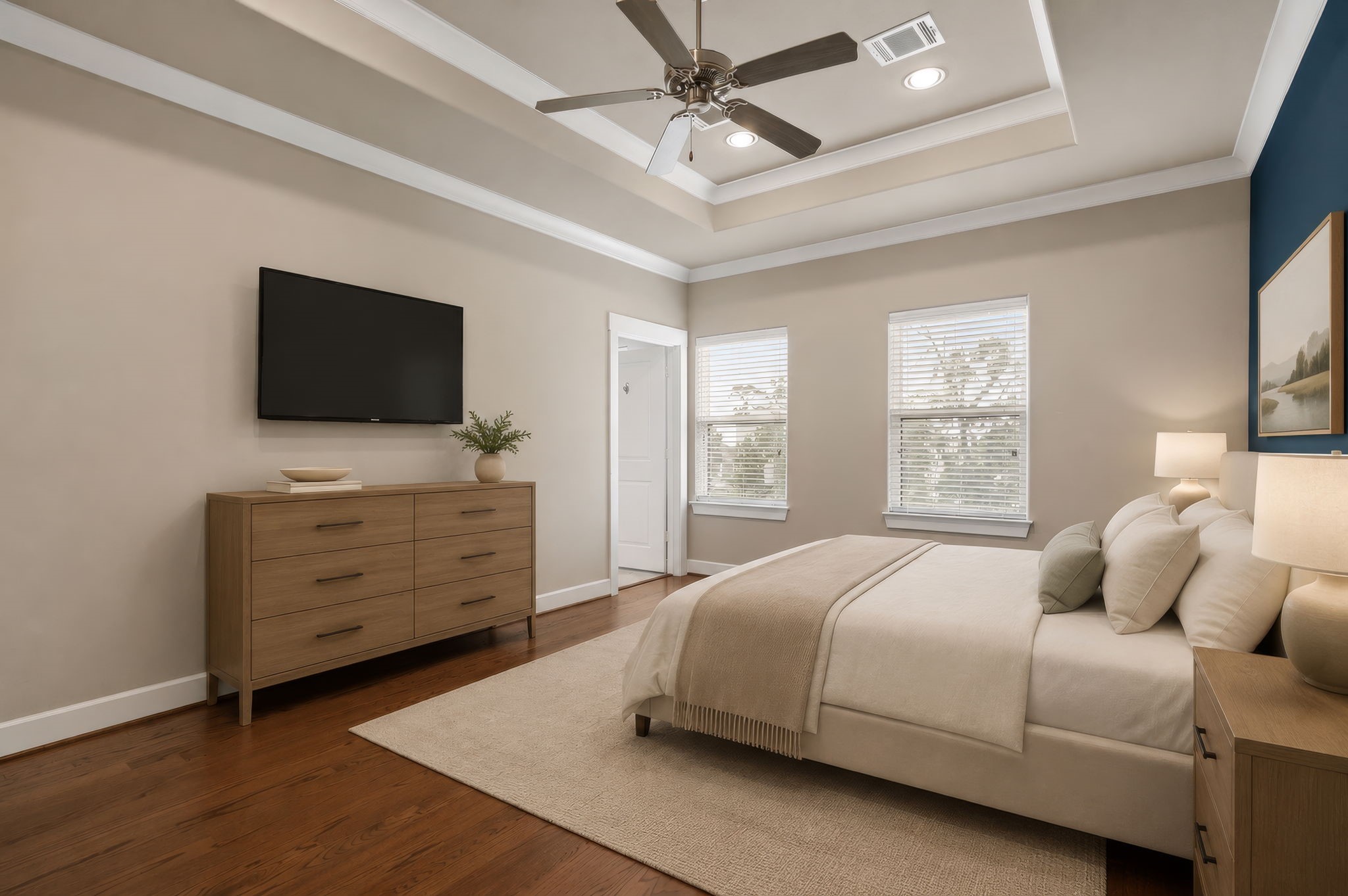 The spacious primary suite with spa-like en suite bath is a true retreat. (Digitally staged.)