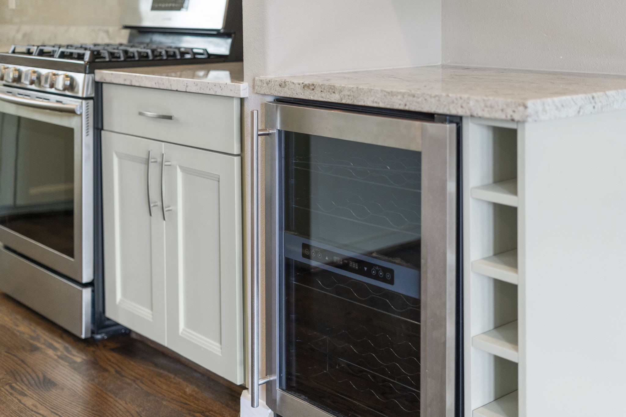 A Magic Chef beverage cooler with a dedicated counter space creates a bar area for entertaining, offering a stylish and functional spot to serve drinks and gather with guests.