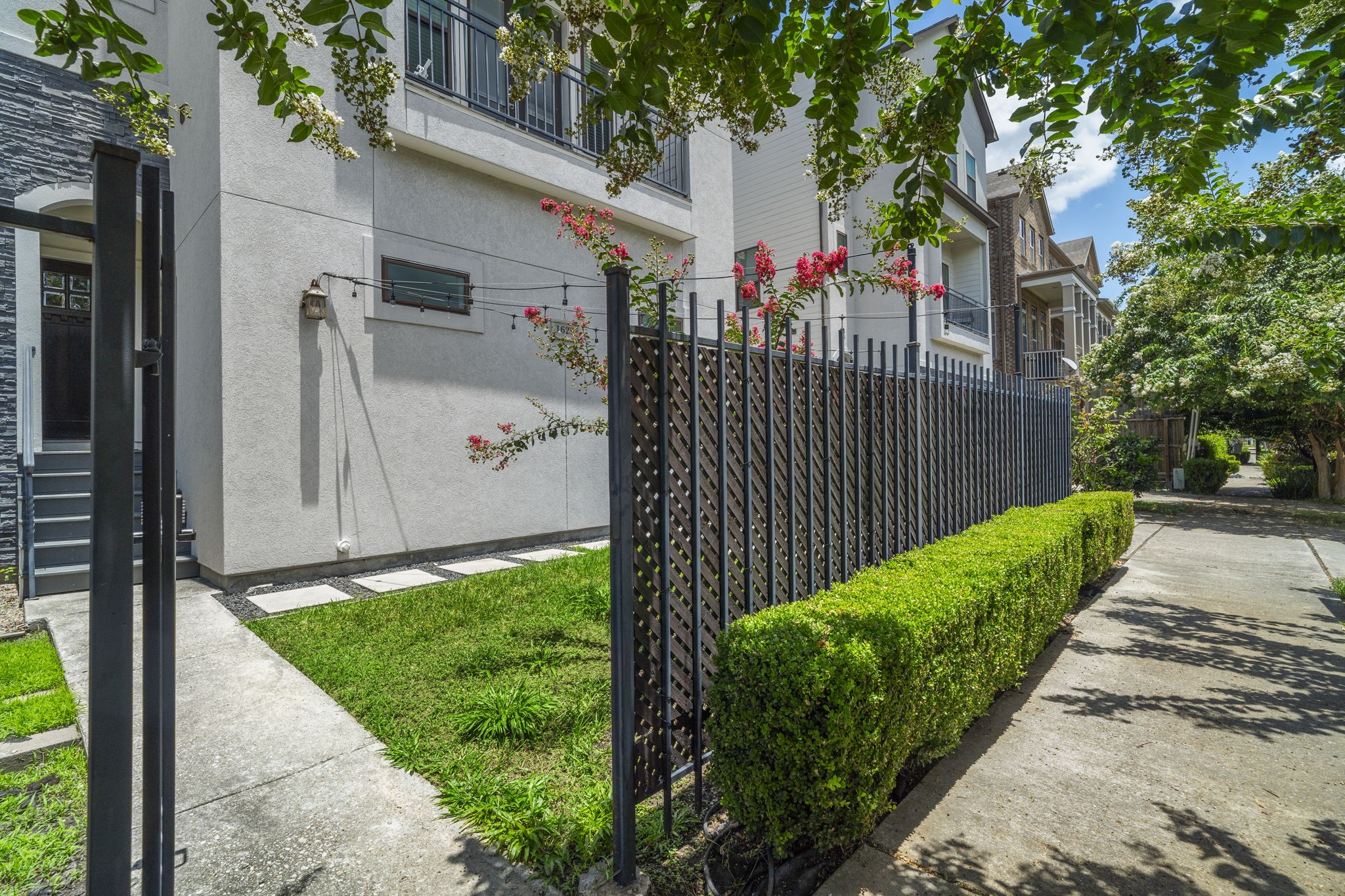 Enjoy outdoor living on the gated front patio or second-floor balconyperfect for relaxing or entertaining.