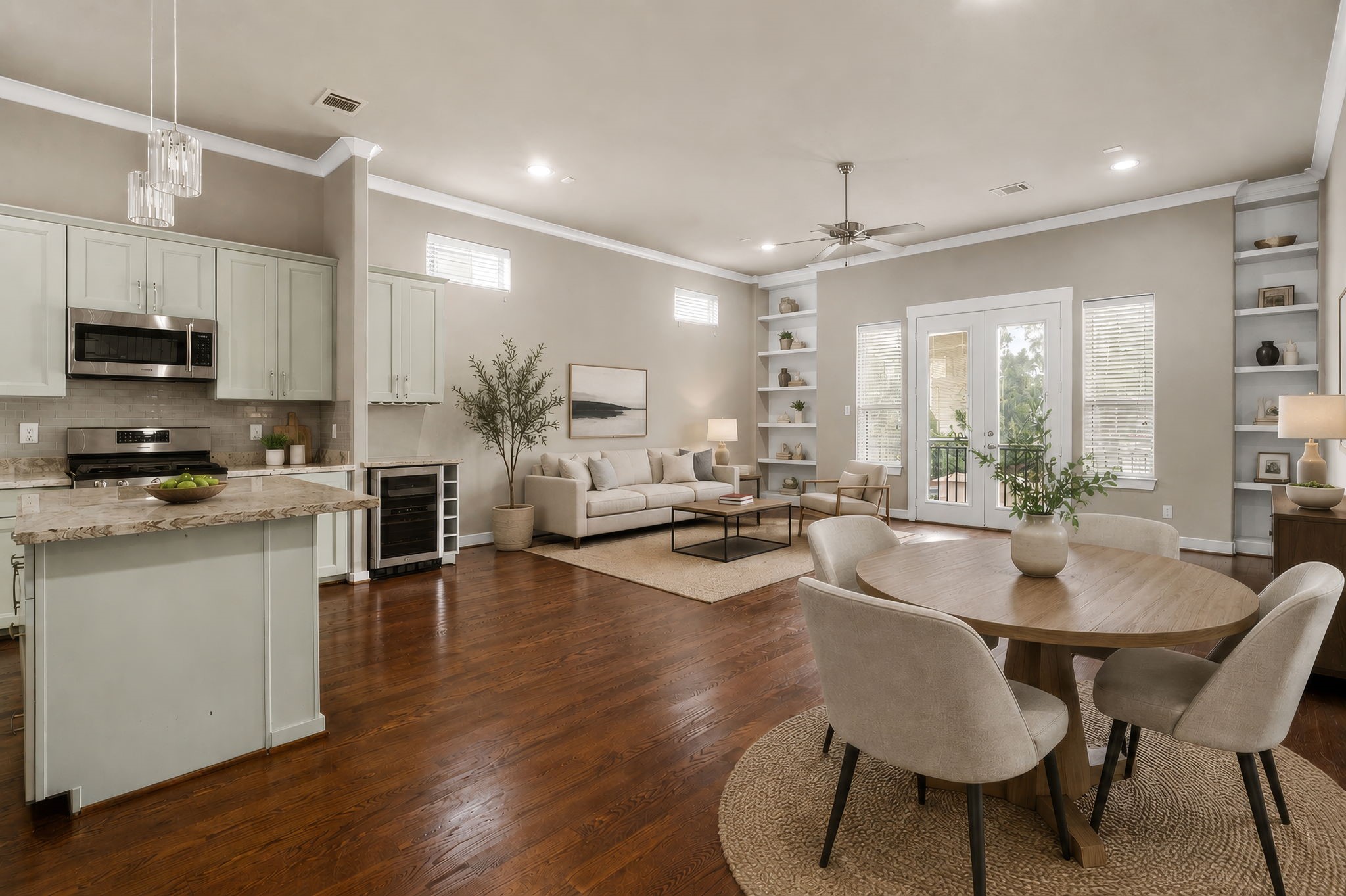 The impressive great room brings together the living area, dining space, and gourmet kitchen in a beautifully connected open-concept design, offering a spacious and inviting setting for everyday living and entertaining. (Digitally staged.)