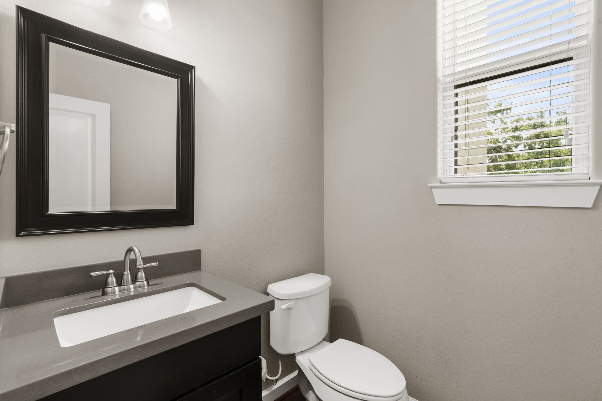 A guest half-bathroom is situated just off the second-floor main living area, offering easy access for both residents and visitors.