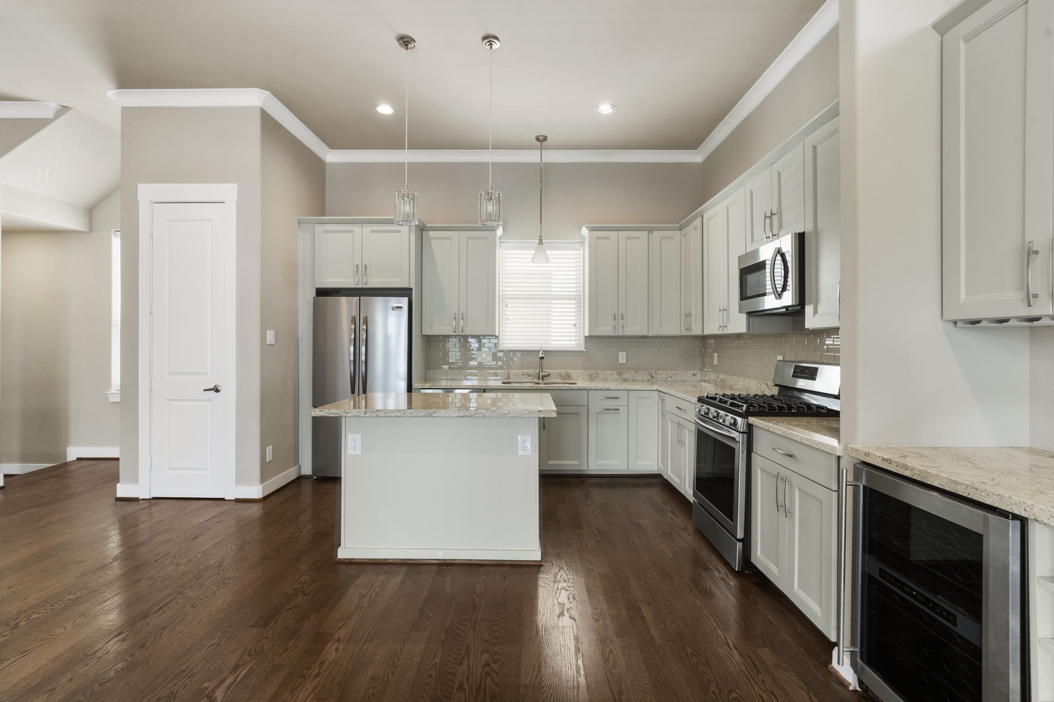 A separate food pantry provides additional storage and keeps kitchen essentials organized and easily accessible.