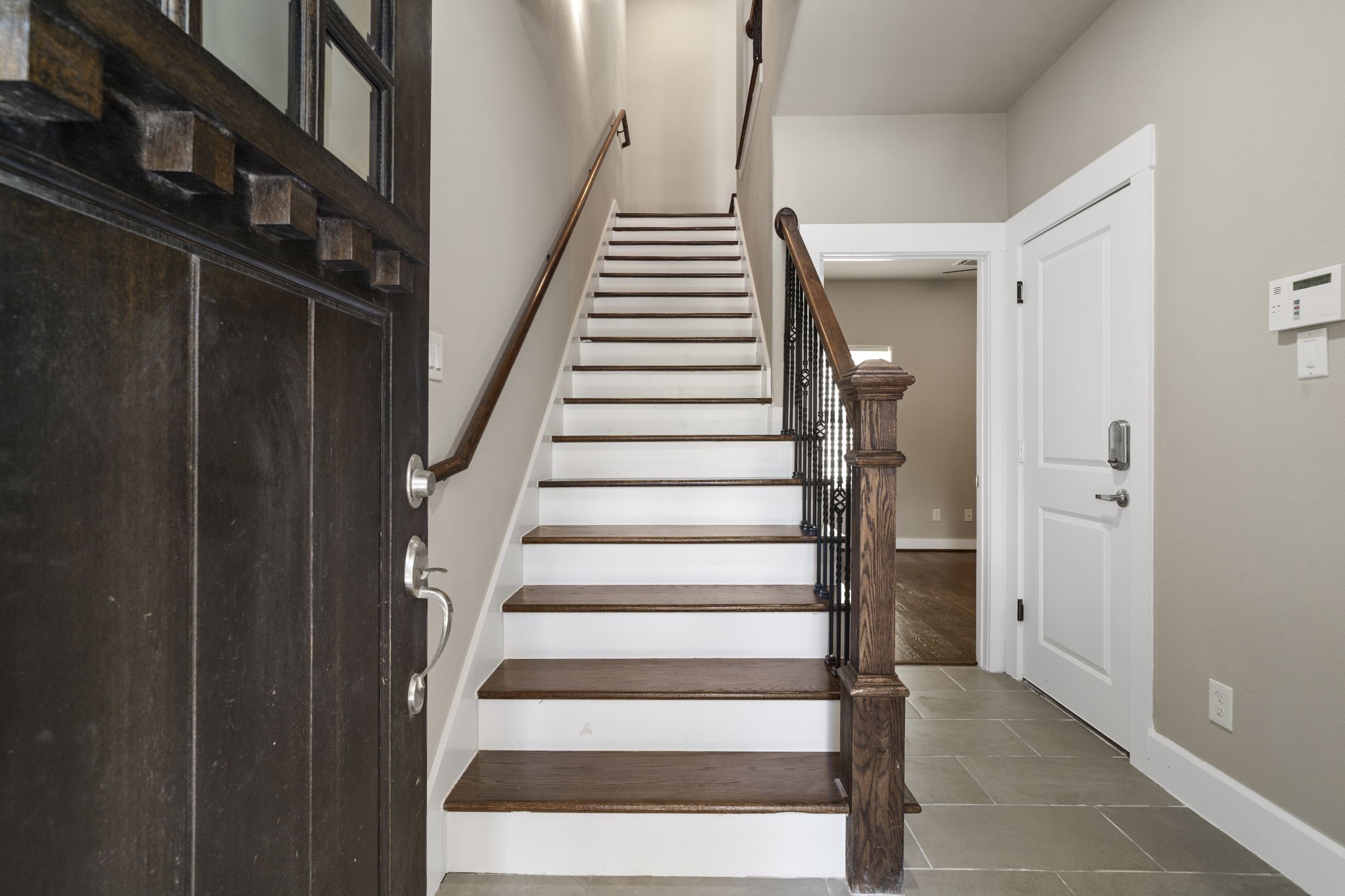 Step inside to high ceilings, classic wood and tile flooring, and stylish lighting throughout.