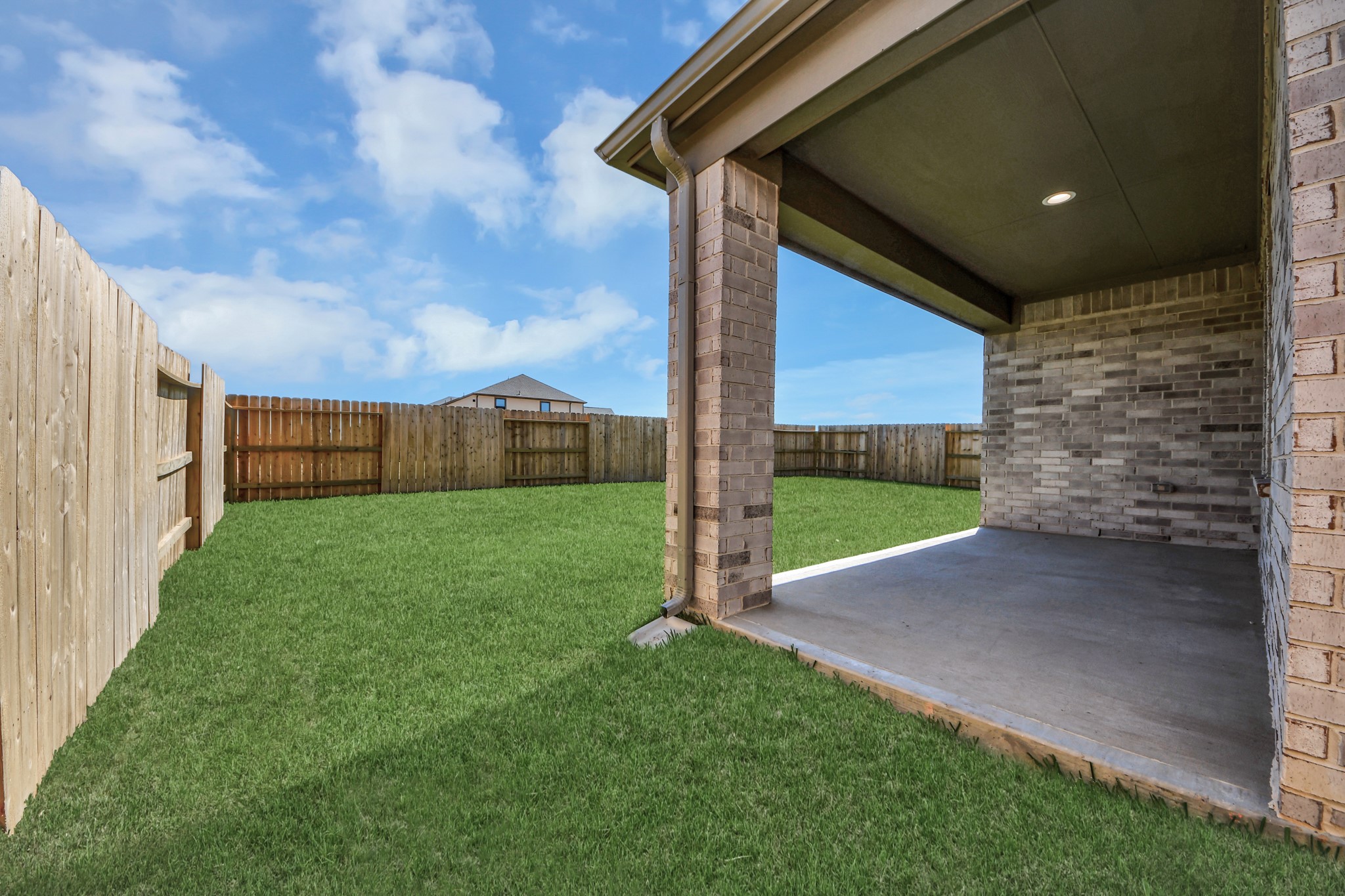 Come and see this spacious backyard with its beautiful covered patio. There is plenty of room for the kids to play and adults to relax. Perfect for your outdoor living space, patio furniture, bbq pit, and so much more. The possibilities are endless!