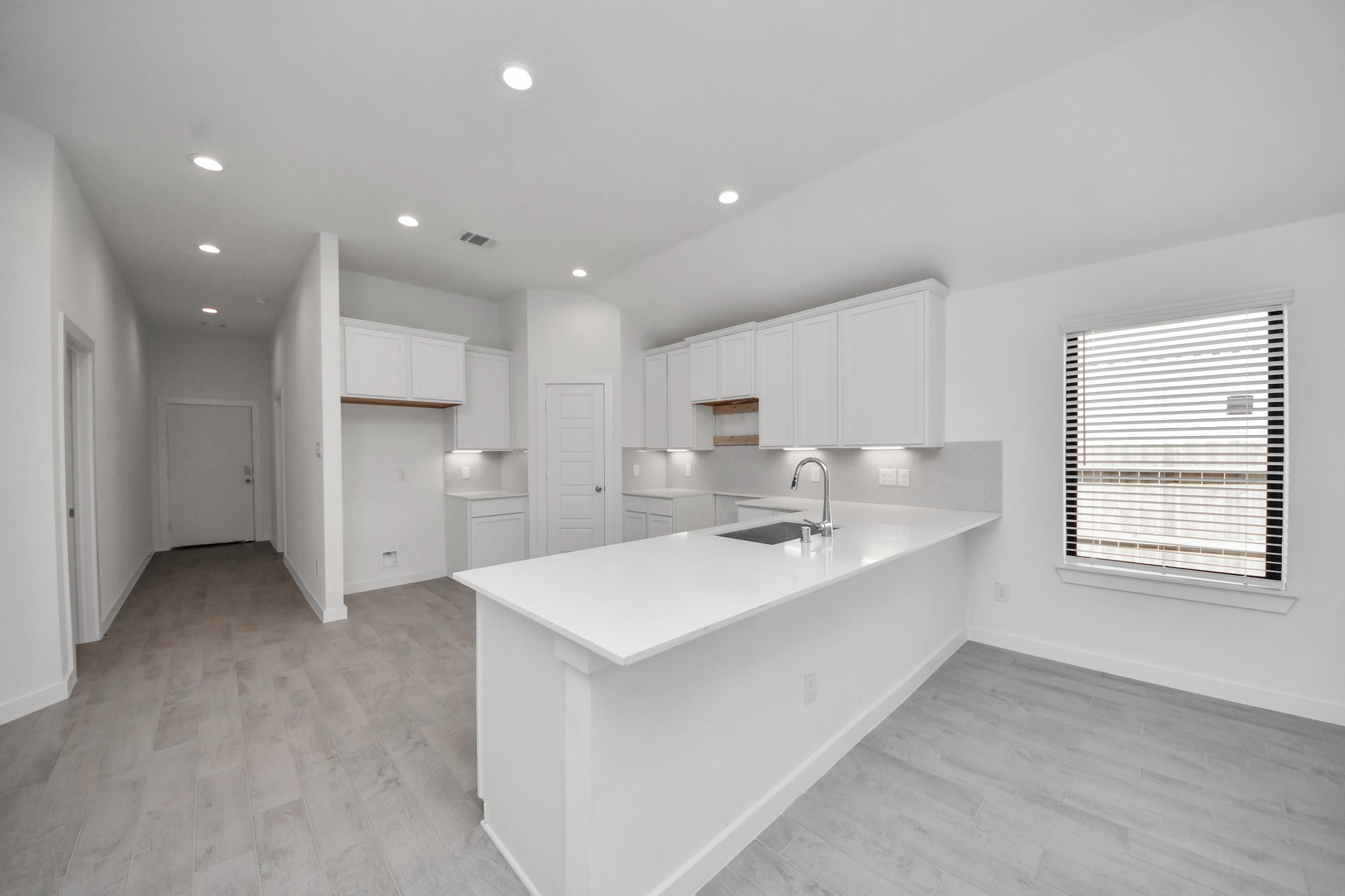 The extended counter area adds both practicality and style, making meal preparation a breeze. Every detail is thoughtfully designed to enhance the kitchen's functionality and aesthetic appeal.