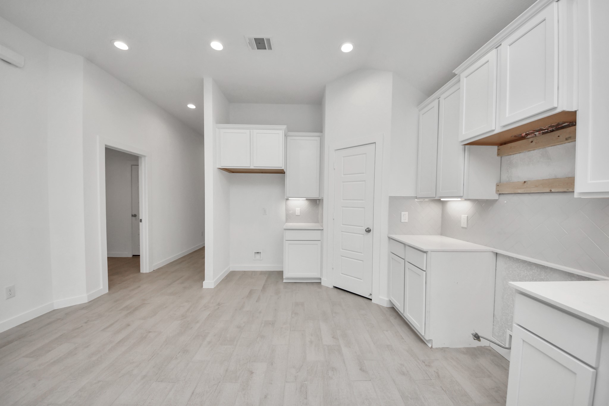 The open concept effortlessly connects the kitchen to the expansive family room, forming a perfect hub for gatherings. This seamless flow creates an inviting space where cooking and socializing come together harmoniously.