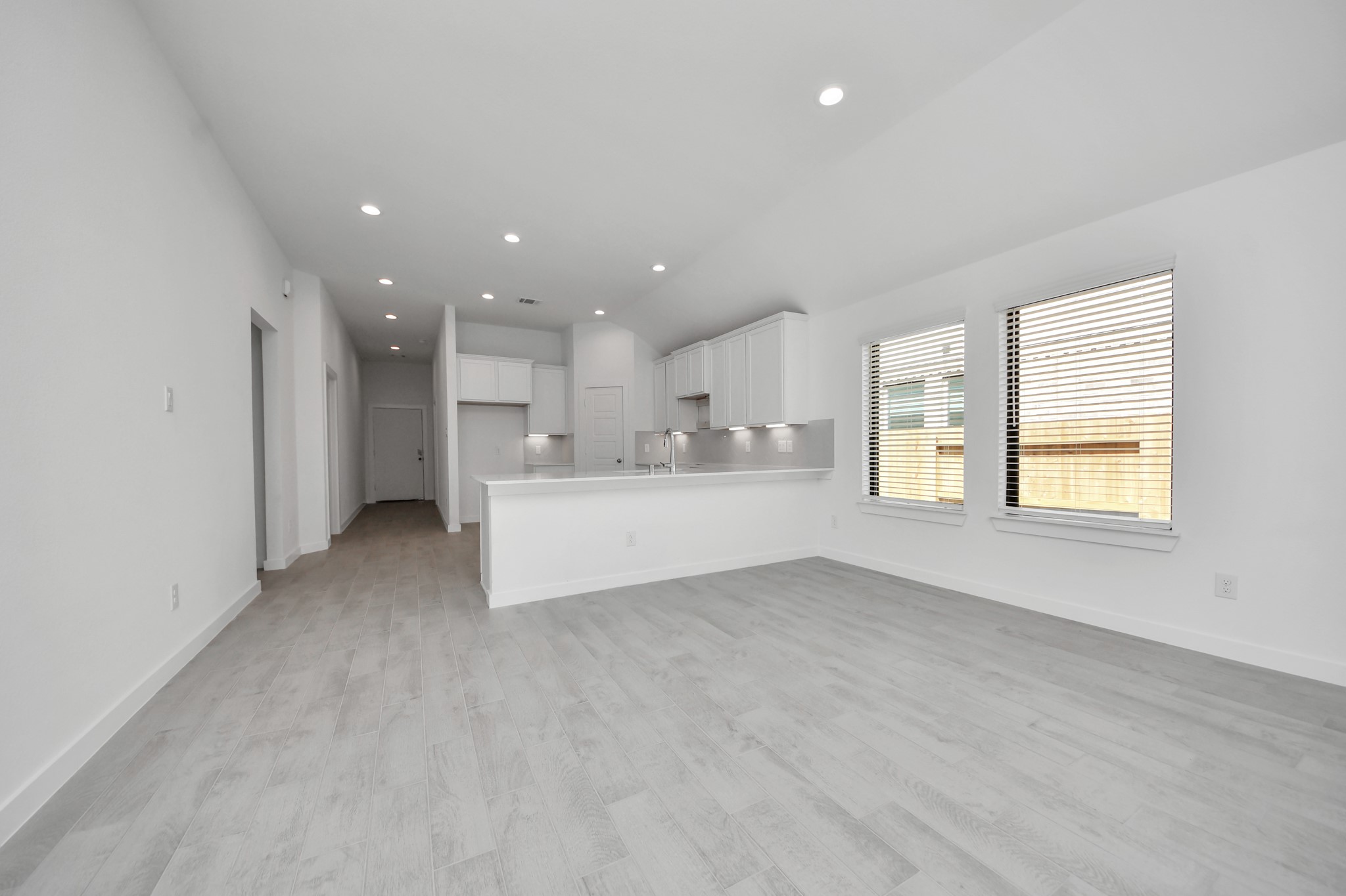 Take another glimpse into the heart of the home with this additional view of the family rooma sprawling space ready to accommodate all your gatherings.