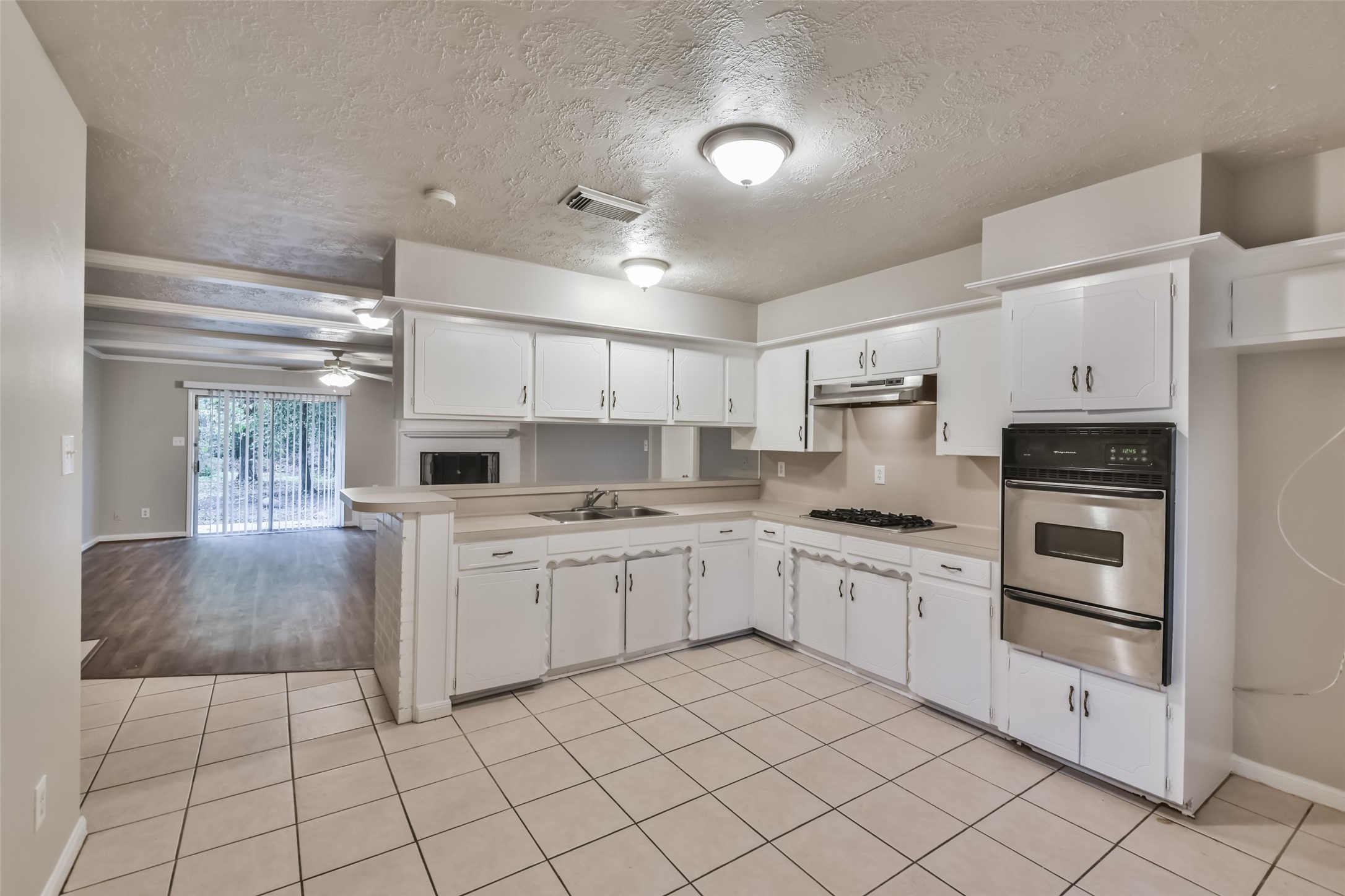 Kitchen features stainless steel appliances.