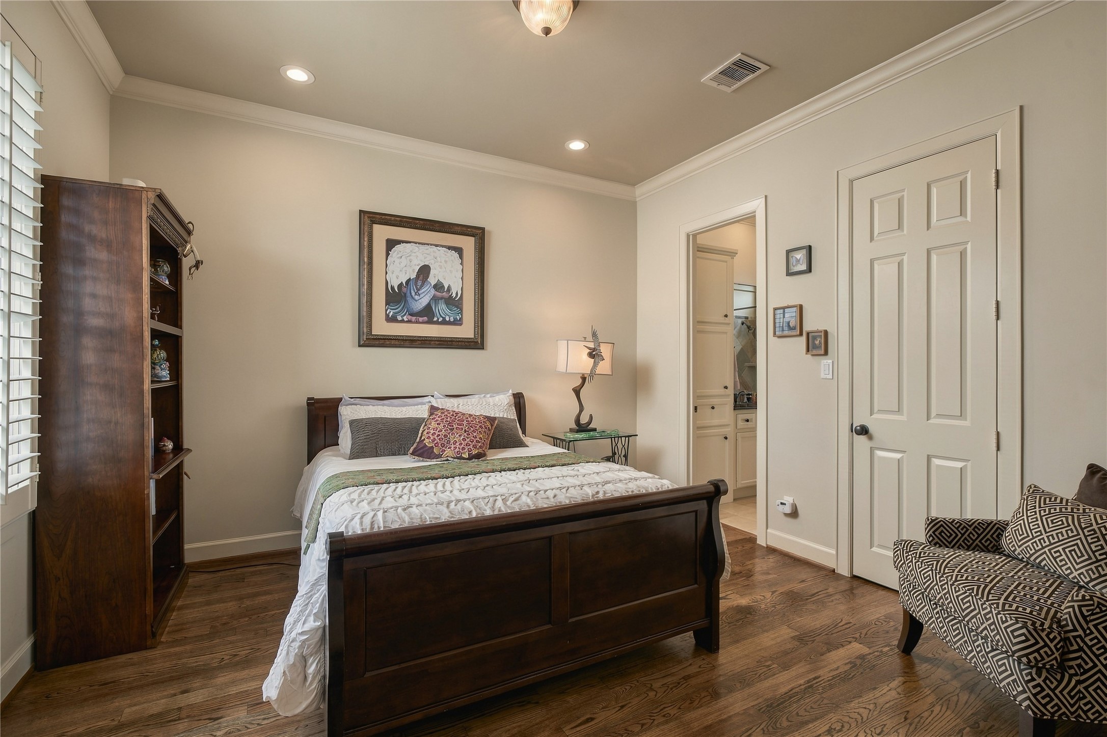 Tucked away on the first floor, this secondary bedroom gives guests a space that feels genuinely private, complete with its own adjoining full bath.