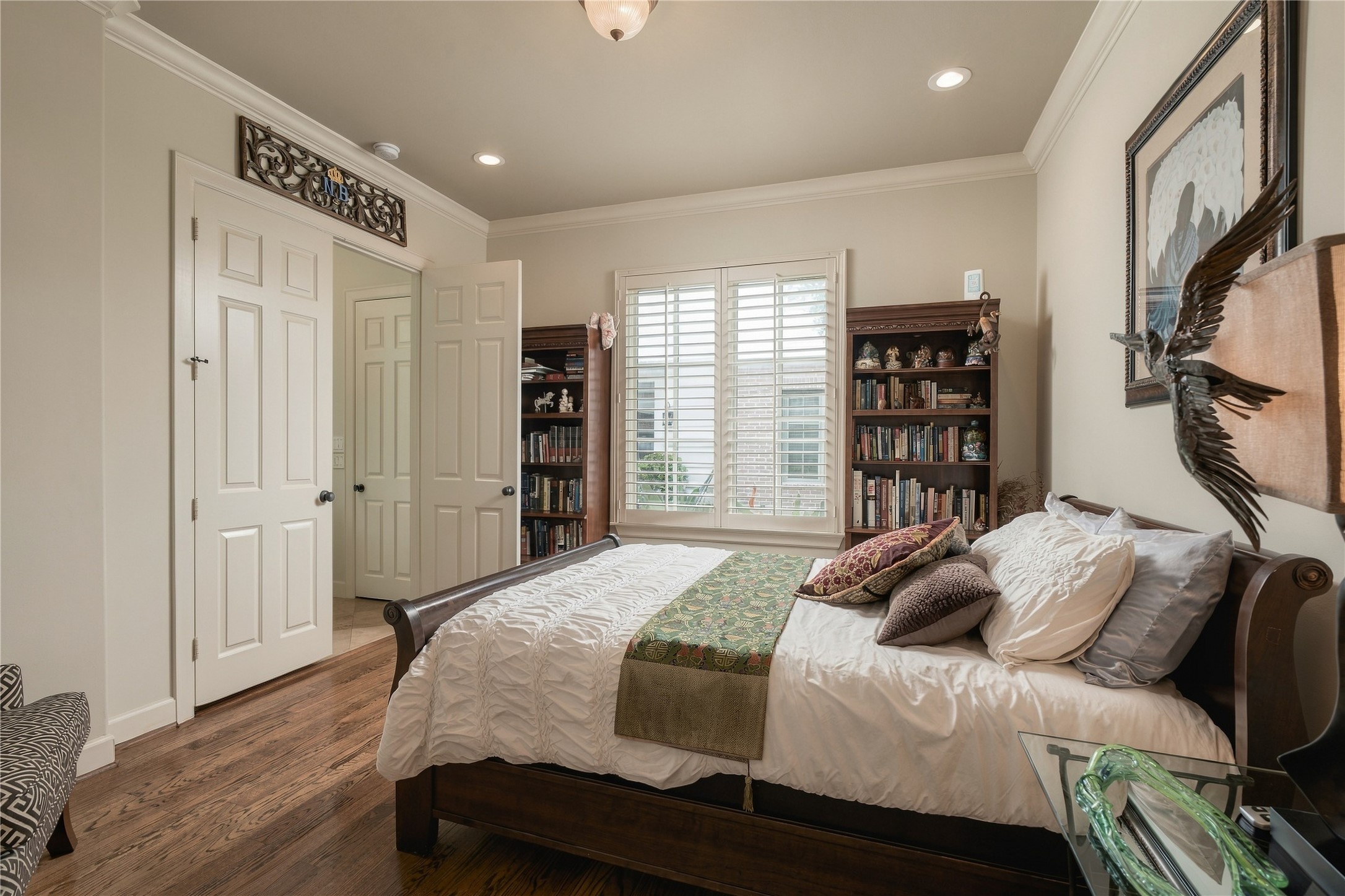 Comfortably proportioned and filled with natural light, the first-floor bedroom has enough room to settle in rather than simply serve as a place to sleep.