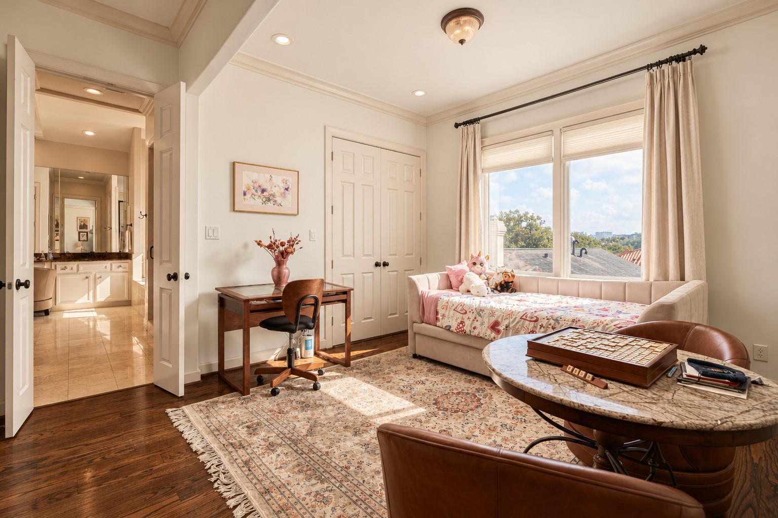 The primary suite extends beyond the bedroom itself, with a flexible adjoining space that now houses the homes relocated laundry while still offering room for an office, dressing area or quiet sitting space. **Rendering of neutral wall color**