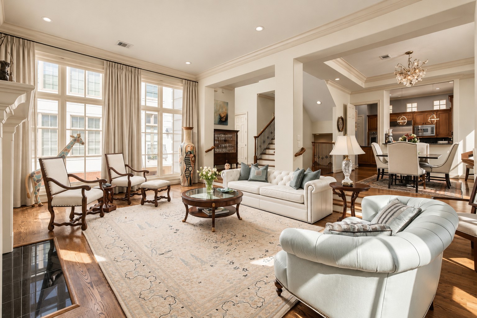 Turn around and the second floor begins to reveal how it all connects, with long sightlines carrying from the living room through dining and into the kitchen. **Rendering of neutral wall color**