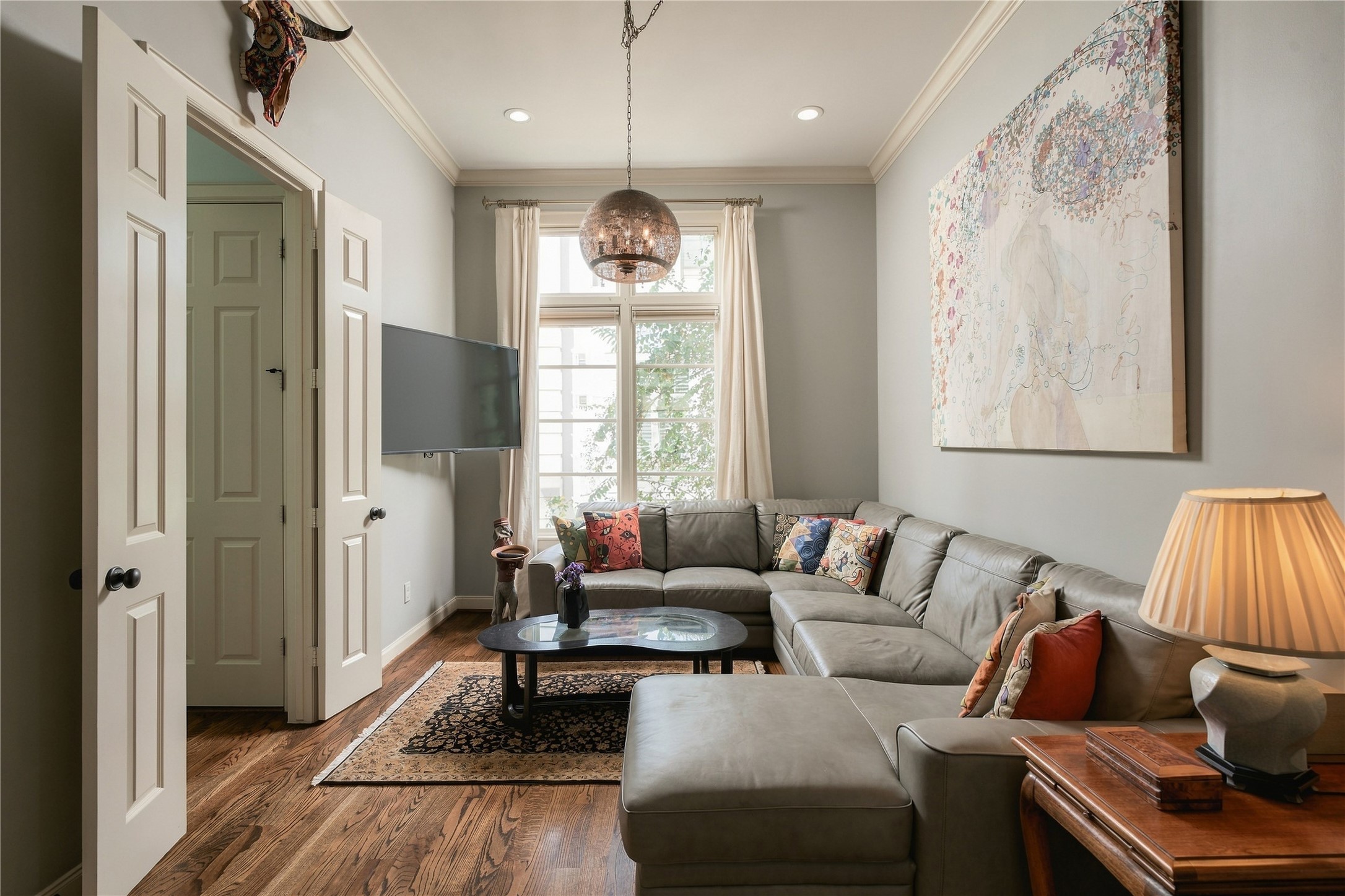 Designed to flex with everyday life, this space just off the kitchen works equally well as a casual living room or a sunny breakfast area for slow mornings at home.