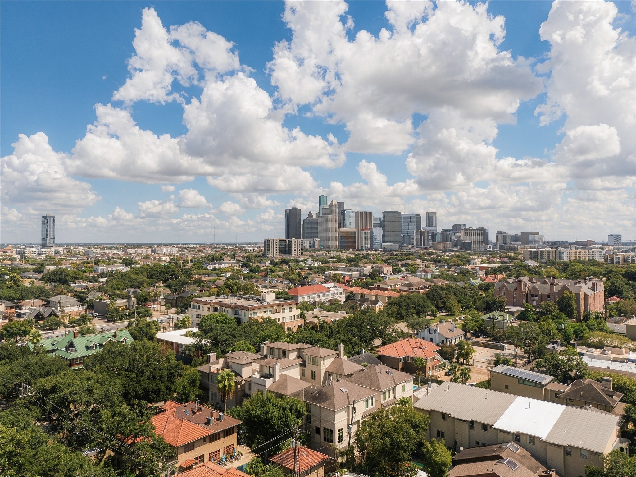 Sweeping aerial views showcase 523 Lovetts close-in Montrose setting and unmistakable Downtown Houston skyline backdrop.