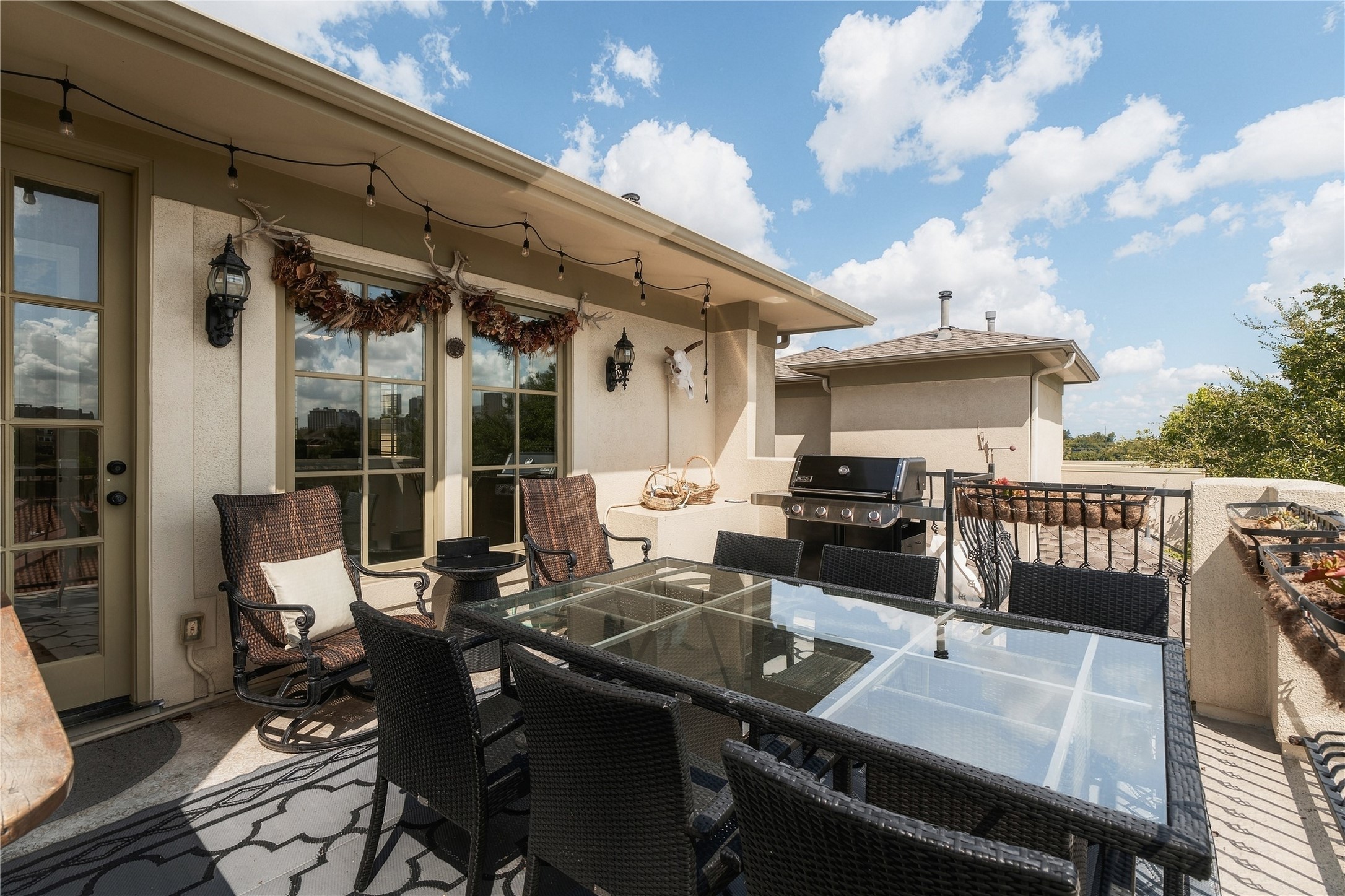 The expansive rooftop terrace creates a true outdoor living and dining space with room to entertain, grill and take in the surrounding city views.