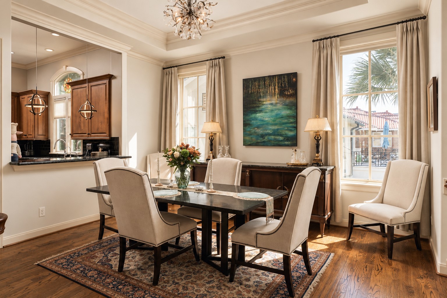 Set between the living room and kitchen, the dining room feels made for the part of the night when dinner runs long and no one is quite ready to leave the table. **Rendering of neutral wall color**