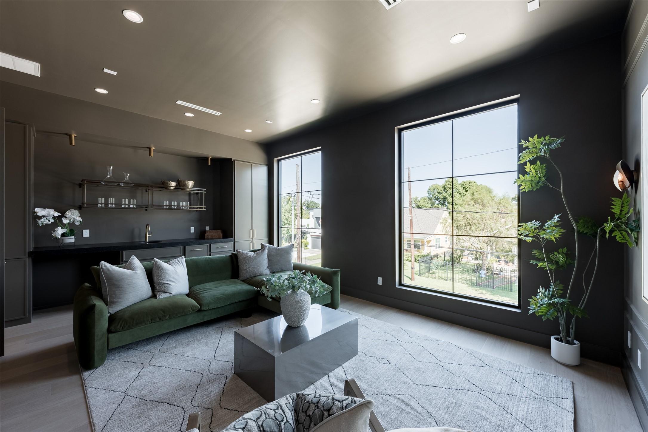 The dedicated media room sets a mood of its own, with darker finishes, generous proportions and large windows creating a comfortable retreat for movie nights and entertaining.