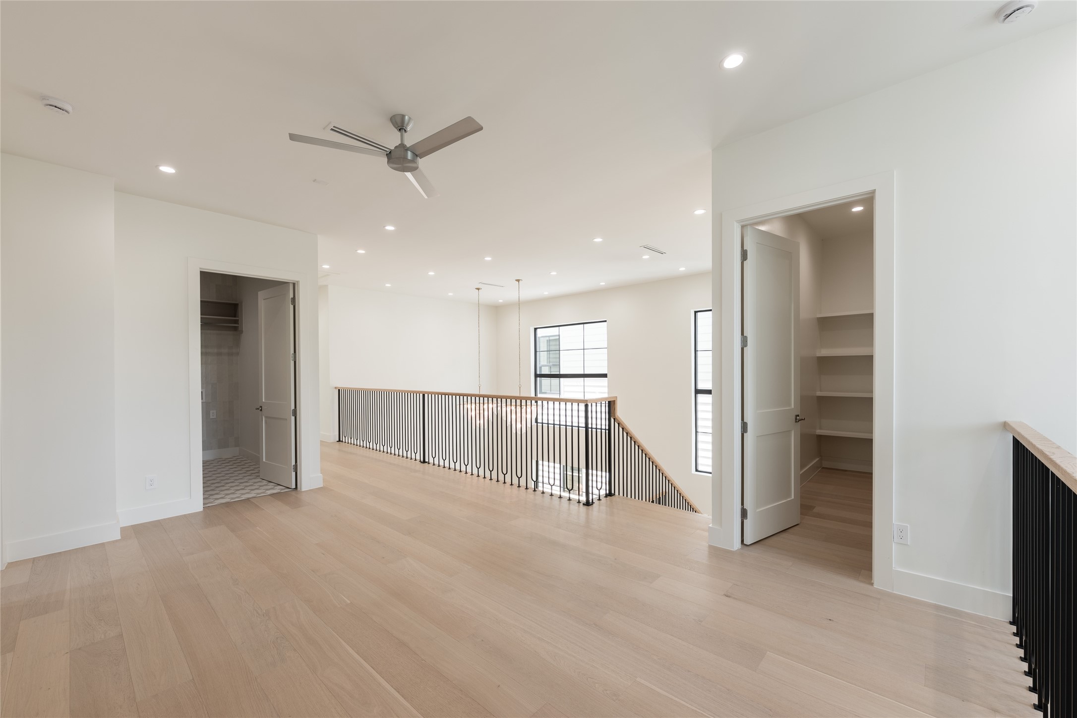 The upstairs flex space continues the home's thoughtful architectural language. Generous proportions allow the room to evolve effortlessly from a secondary living area to a private lounge, creative studio, or additional workspace.