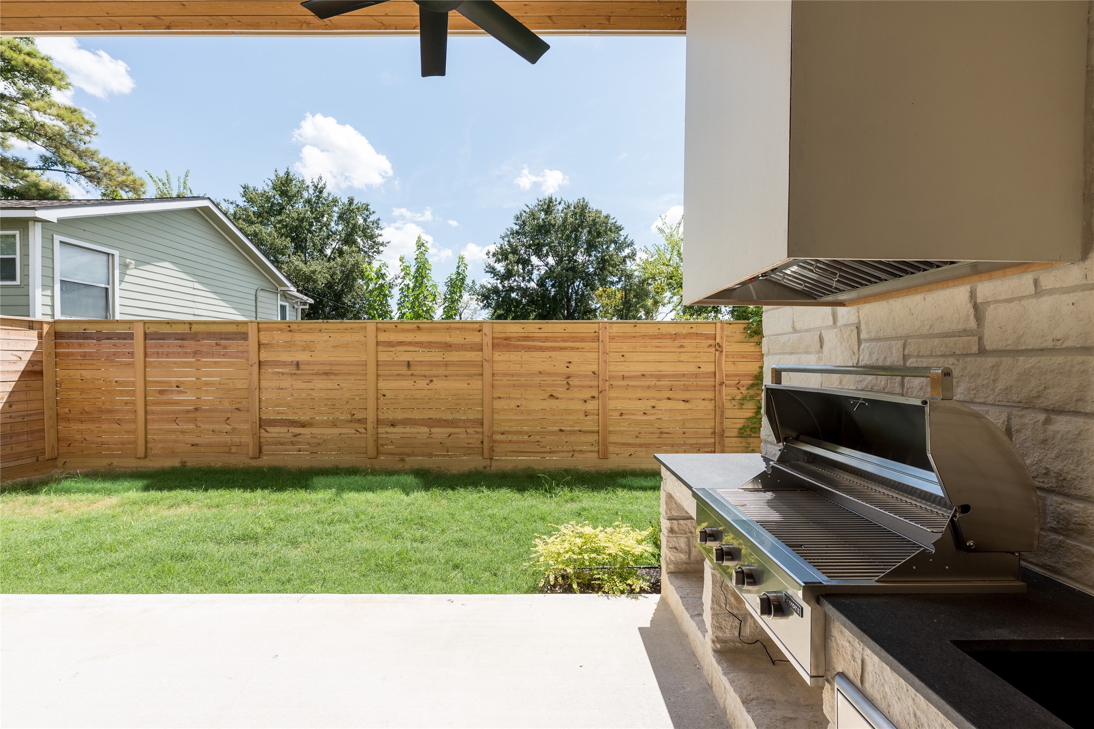 A built in grill makes the covered patio ready for outdoor cooking and entertaining, while the fenced backyard leaves plenty of open lawn for play, pets or simply enjoying the outdoors.