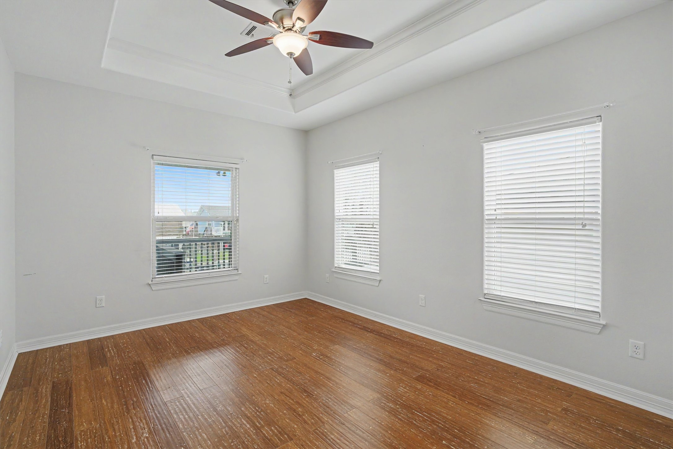 The primary bedroom, where tranquility meets breathtaking beauty. This spacious retreat offers ample room for all your furnishings, creating a harmonious blend of comfort and style. Wake up to the gentle embrace of natural light streaming through expansive windows, providing uninterrupted views of the water